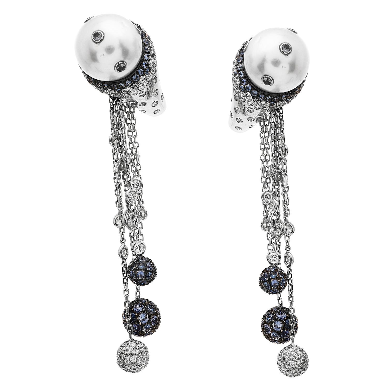 the unique Design for these Cluster Style Earrings is a complete piece of art!

  These dangle chain earrings are crafted in 18K White Gold. With Pave and bezel-set with approx. 2.10 carats of very fine diamonds approx. H-I color and