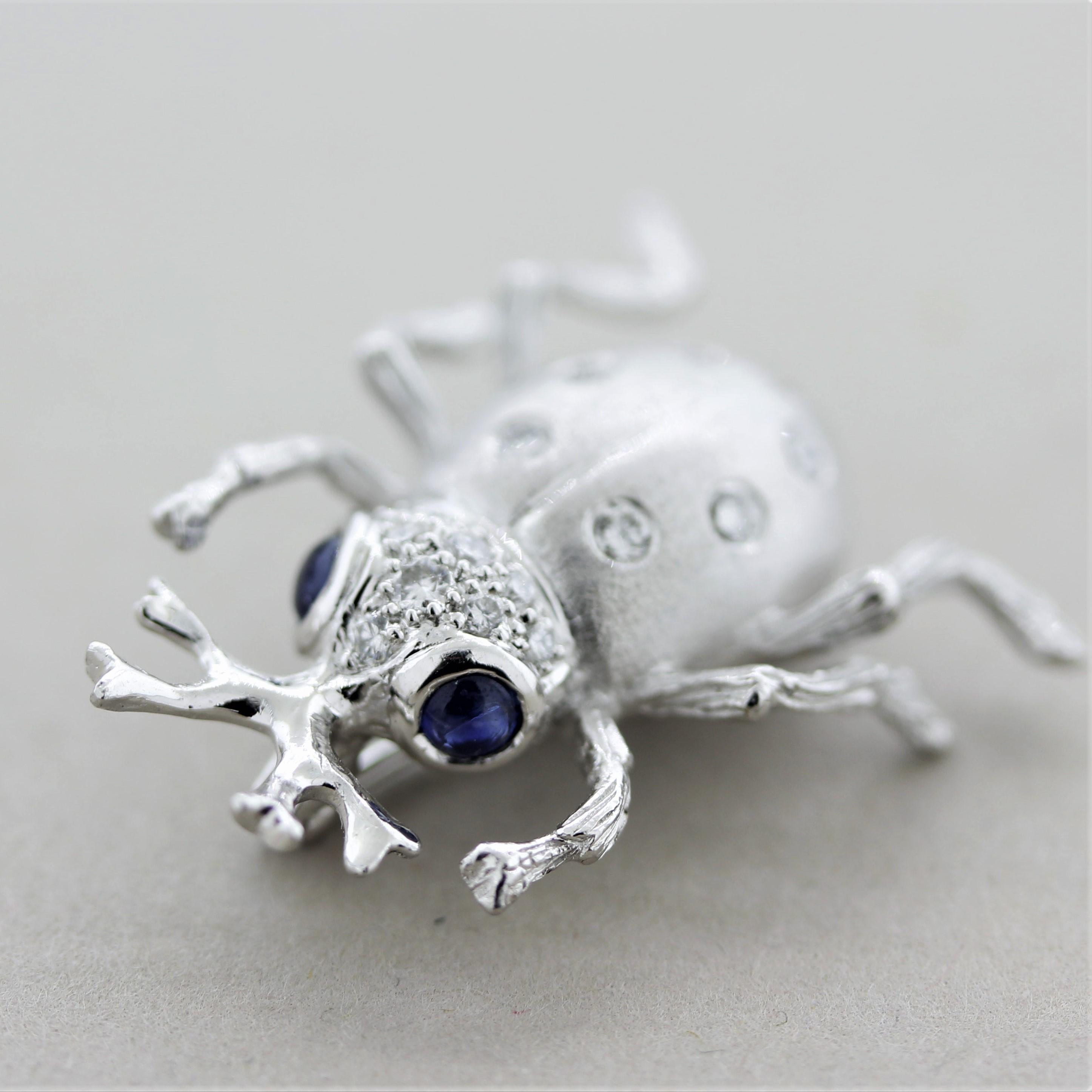 A sweet critter ready to accompany you on your next outing! It features 0.25 carats of round brilliant-cut diamonds set around the beetle’s body along with 2 cabochon sapphires used as its eyes which weigh 0.26 carats. Made in platinum and light