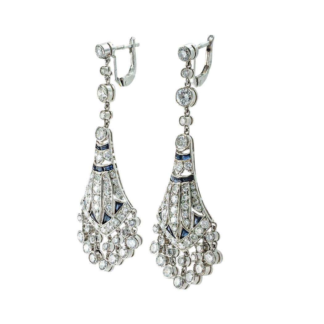 Estate Diamond Sapphire and platinum chandelier earrings. *

ABOUT THIS ITEM:  This pair of diamond chandelier earrings pack plenty of sparkle to light up the night without missing a single step in keeping elegance and style in line.  And their size