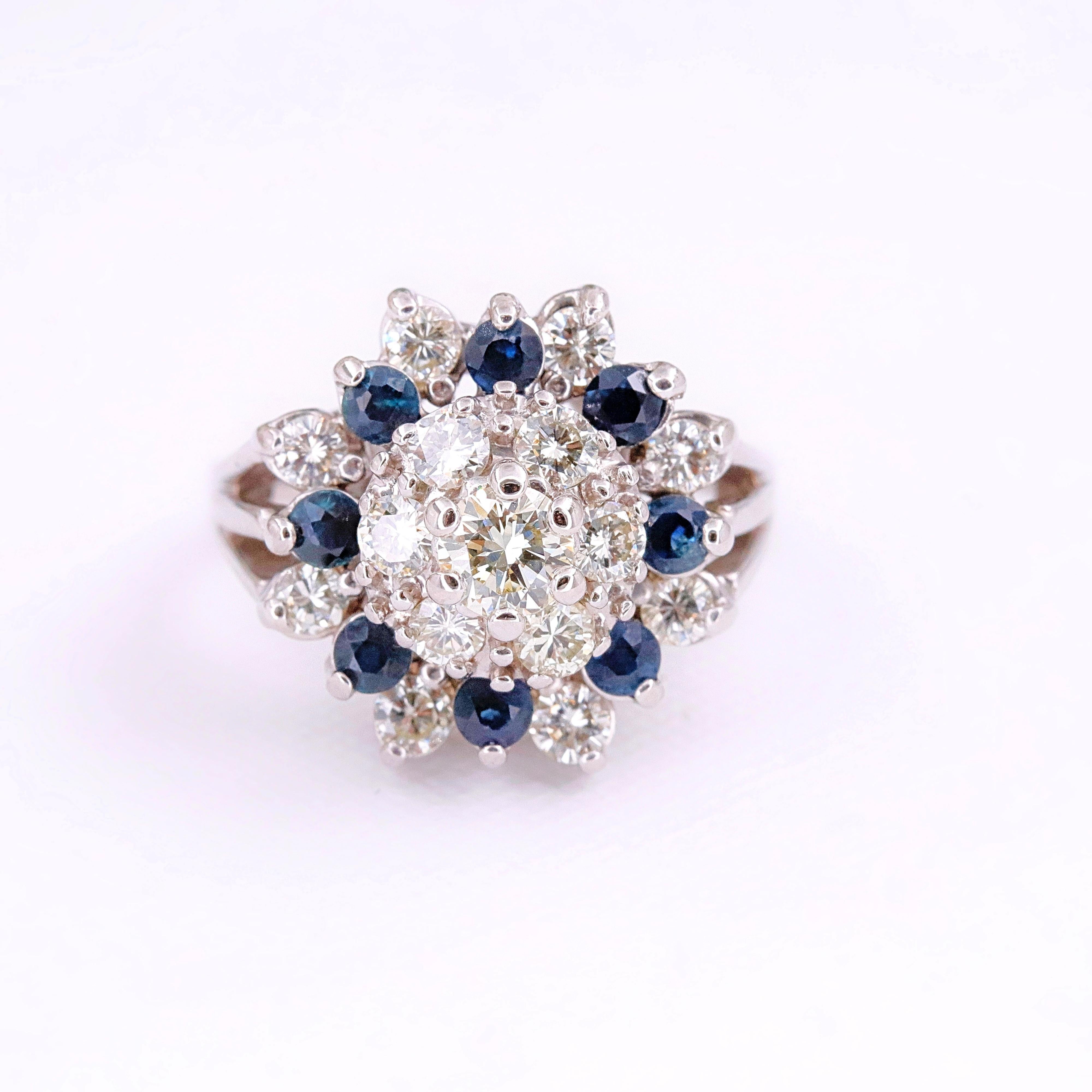 Diamond & Sapphire Princess Style Flower Cocktail Ring

Metal: 14k White Gold
Size: 6.5 - sizable
Total Carat Weight: 2.75 tcw
Center Diamond Shape: Round Brilliant Diamond 0.40 cts H - I color, VS2 clarity
Accent Stones: 14 Round Brilliant Diamonds