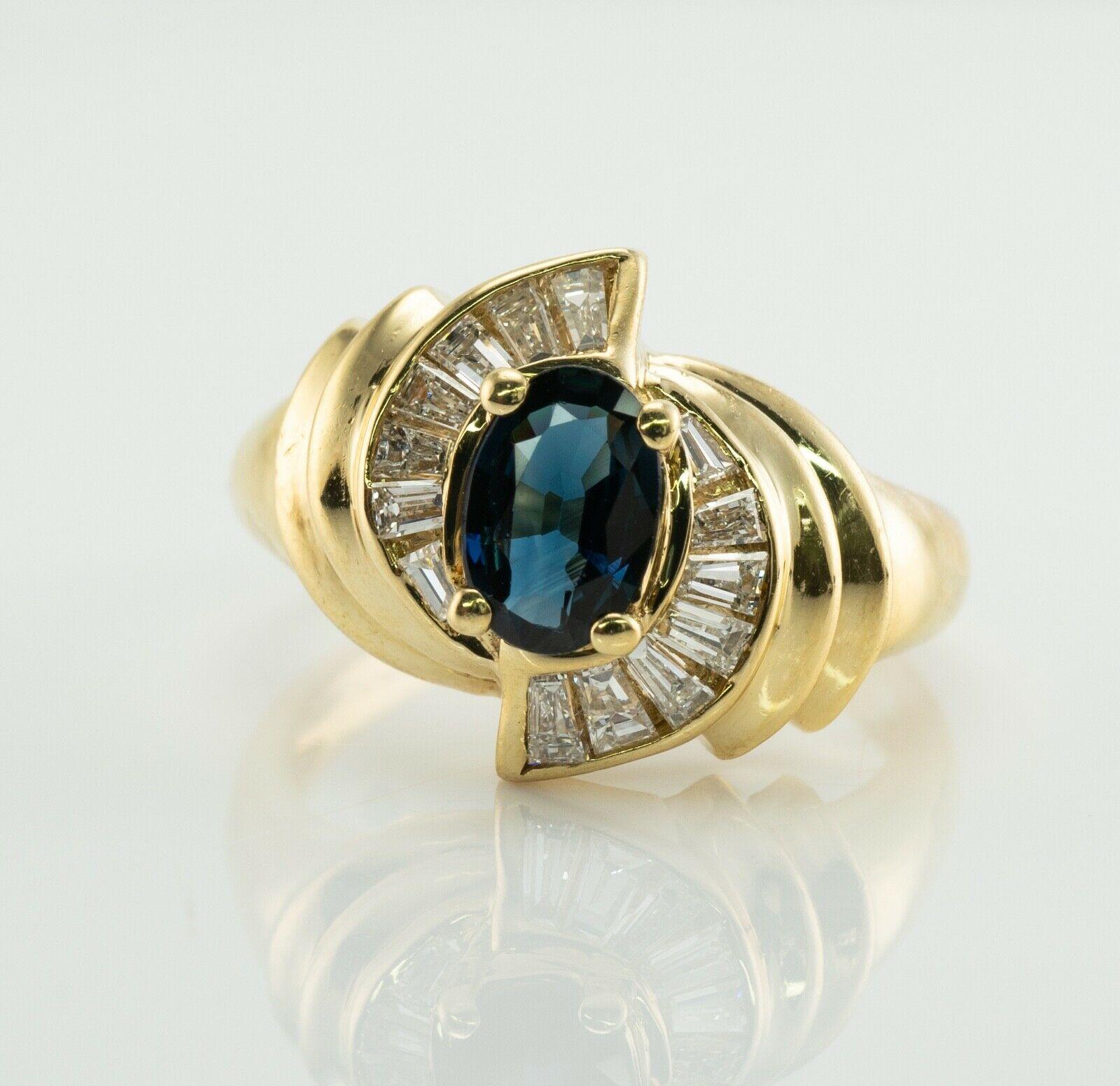 This estate ring is finely crafted in solid 14K Yellow gold and set with natural Earth mined Sapphires and Diamonds. 
The center oval cut blue Sapphire measures 7x5mm (1.00 carat). 
This is a clean gem of a great intensity.
The center stone is
