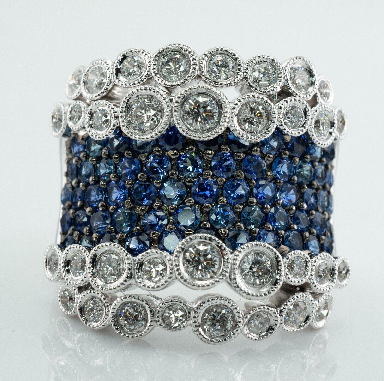 Diamond Sapphire Ring 18K White Gold Wide Band

This amazing showstopper ring is crafted in solid 18K White Gold.
There are genuine Earth mined 59 round cut sapphires, 2mm each = 2.95 carats total weight.
34 round brilliant cut diamonds graduate