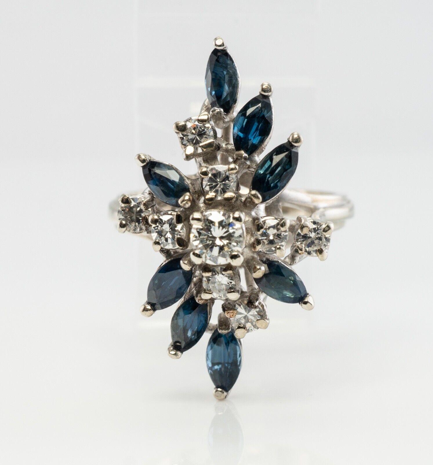 This beautiful vintage ring is finely crafted in solid 14K White gold and set with genuine Earth mined Sapphires and diamonds. Eight marquise cut Sapphires measure 4mm x 2mm each for the total 1.04 carats. These gems are very clean and transparent,