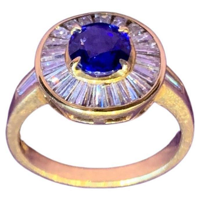 Diamond & Sapphire Ring

An 18 karat yellow gold ring set with an oval sapphire at the center of a halo of 22 baguette cut diamonds

Total Approximate Diamond Weight: 1.30 carats
Approximate Sapphire Weight: 1.00 carats

Stamped 18K, 750

Ring Size: