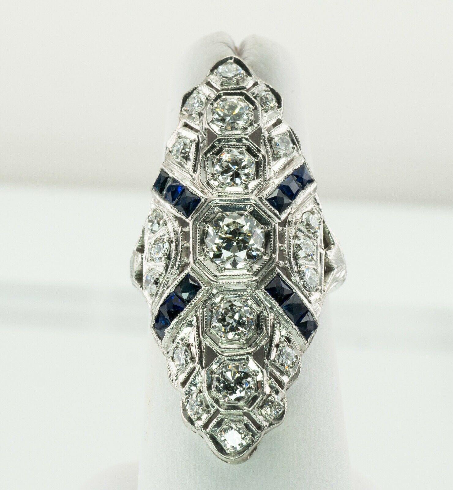Diamond Sapphire Ring Platinum Edwardian Antique C.1910s European Cut

This gorgeous vintage circa 1910s luxurious Platinum ring is set with diamonds and sapphires.
The center old European cut diamond is .50 carat. Four round cut diamonds total .90