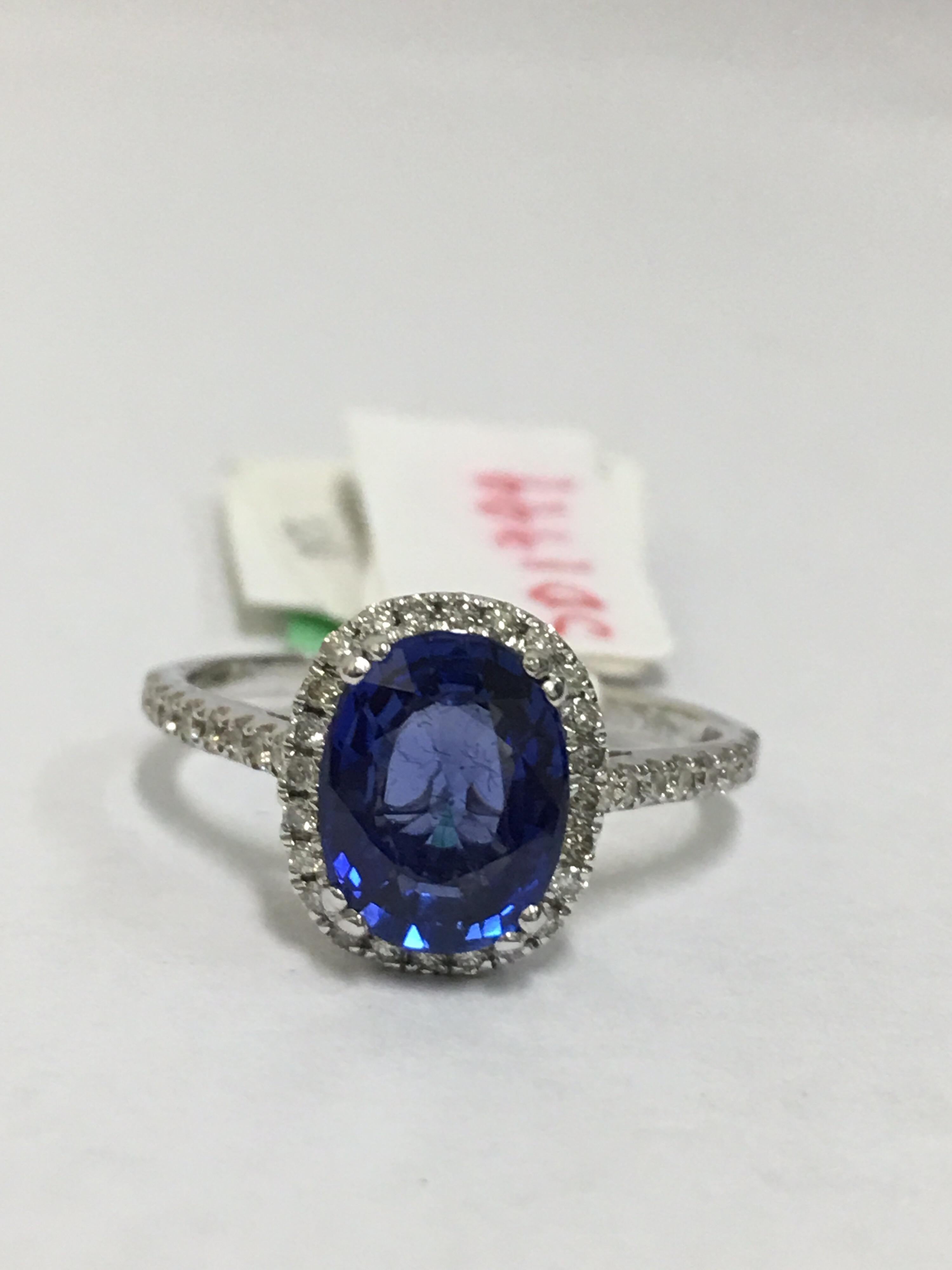 Blue sapphire with diamonds set in 14 Karat white Gold.
Sapphire weight is 2.48 Carat.
Diamonds halo are 0.29 all matched stones.