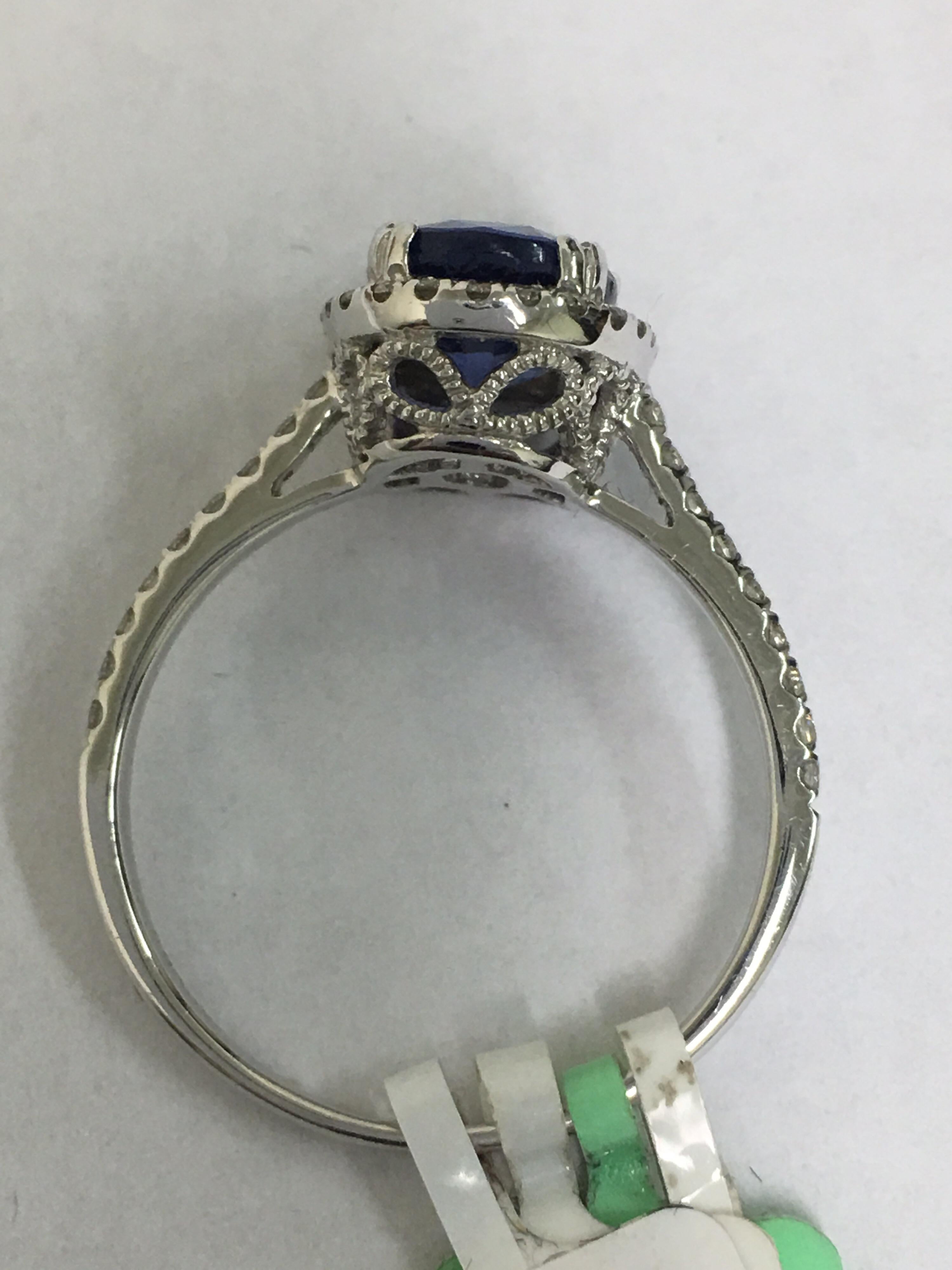 Oval Cut Diamond Sapphire Ring Set in Gold
