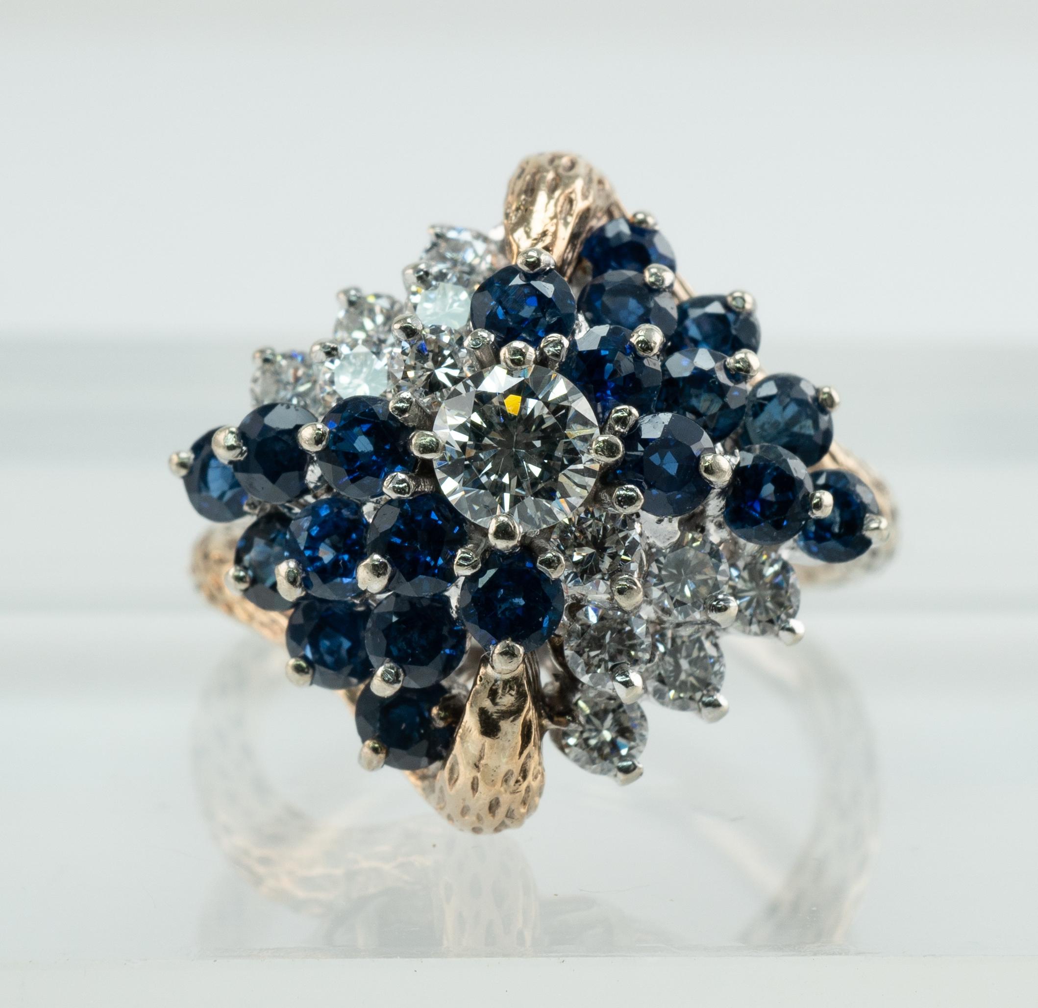 Diamond Sapphire Ring 14K Gold Vintage Cluster

This beautiful vintage ring is finely crafted in solid 14K Yellow gold.
Circa 1960s.
The center round brilliant cut is .33 carat of VS1 clarity and G color. 
12 more diamonds total .96 carat of VS1
