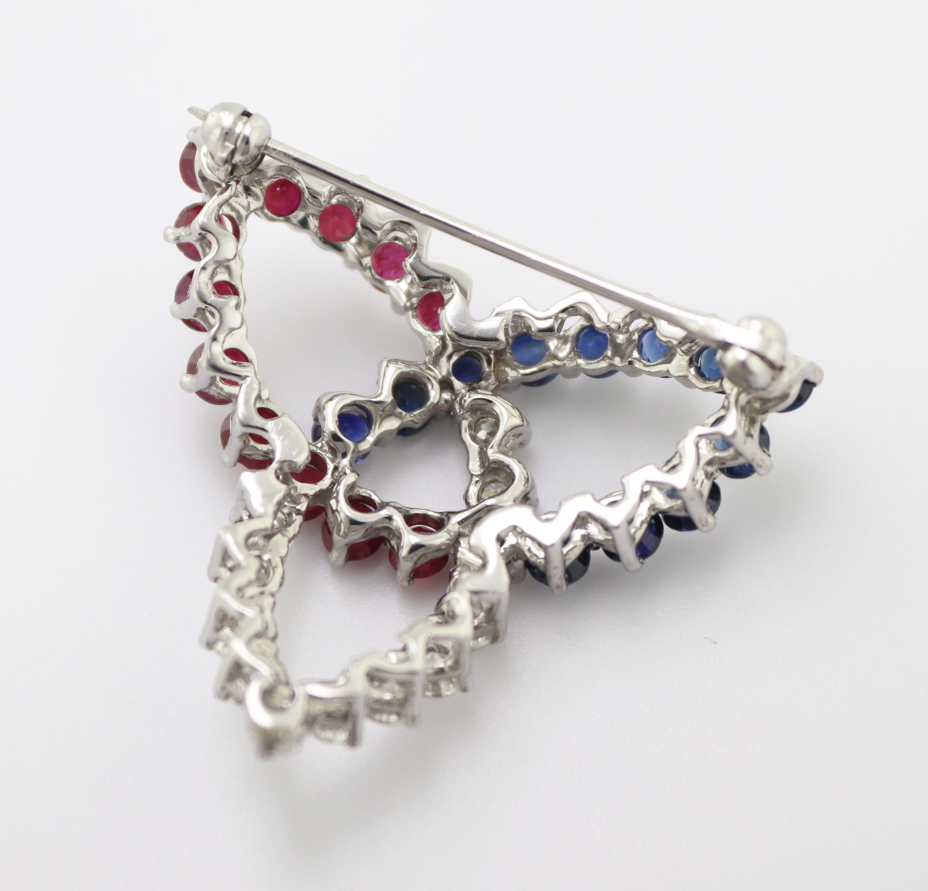 Artisan Diamond, Sapphire, Ruby, 10K White Gold Trinity Knot Brooch For Sale