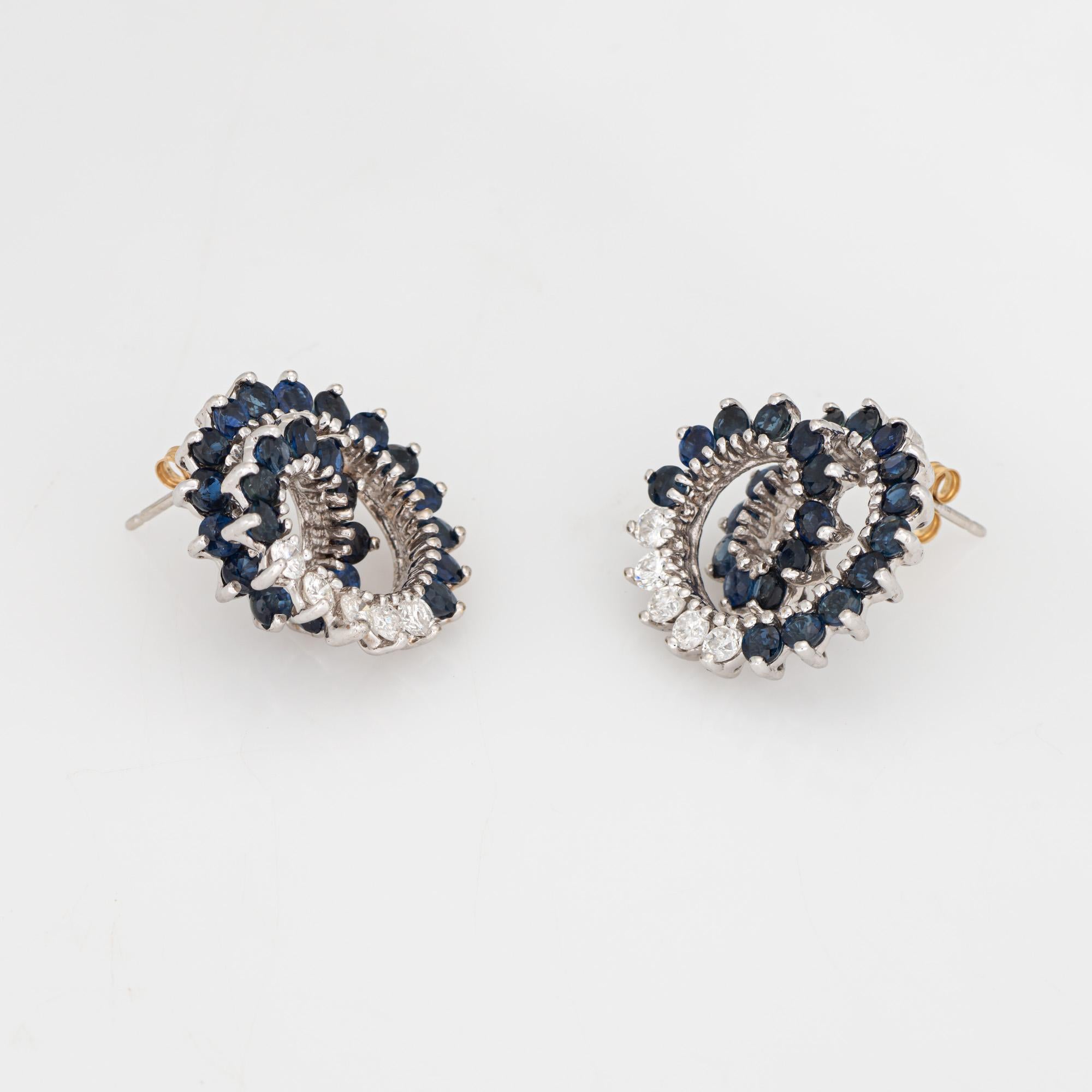 Stylish diamond & sapphire earrings crafted in 14k white gold (circa 1980s).

Diamonds total an estimated 0.50 carats (estimated at H-I color and SI1-I1 clarity). Sapphires measure approx. 2mm each. 

The beautiful earrings highlight sapphires and