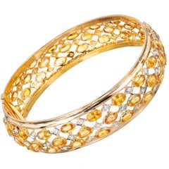28.30 Carat Diamond Sapphire Three-Row Yellow Gold Hinged Bangle Bracelet