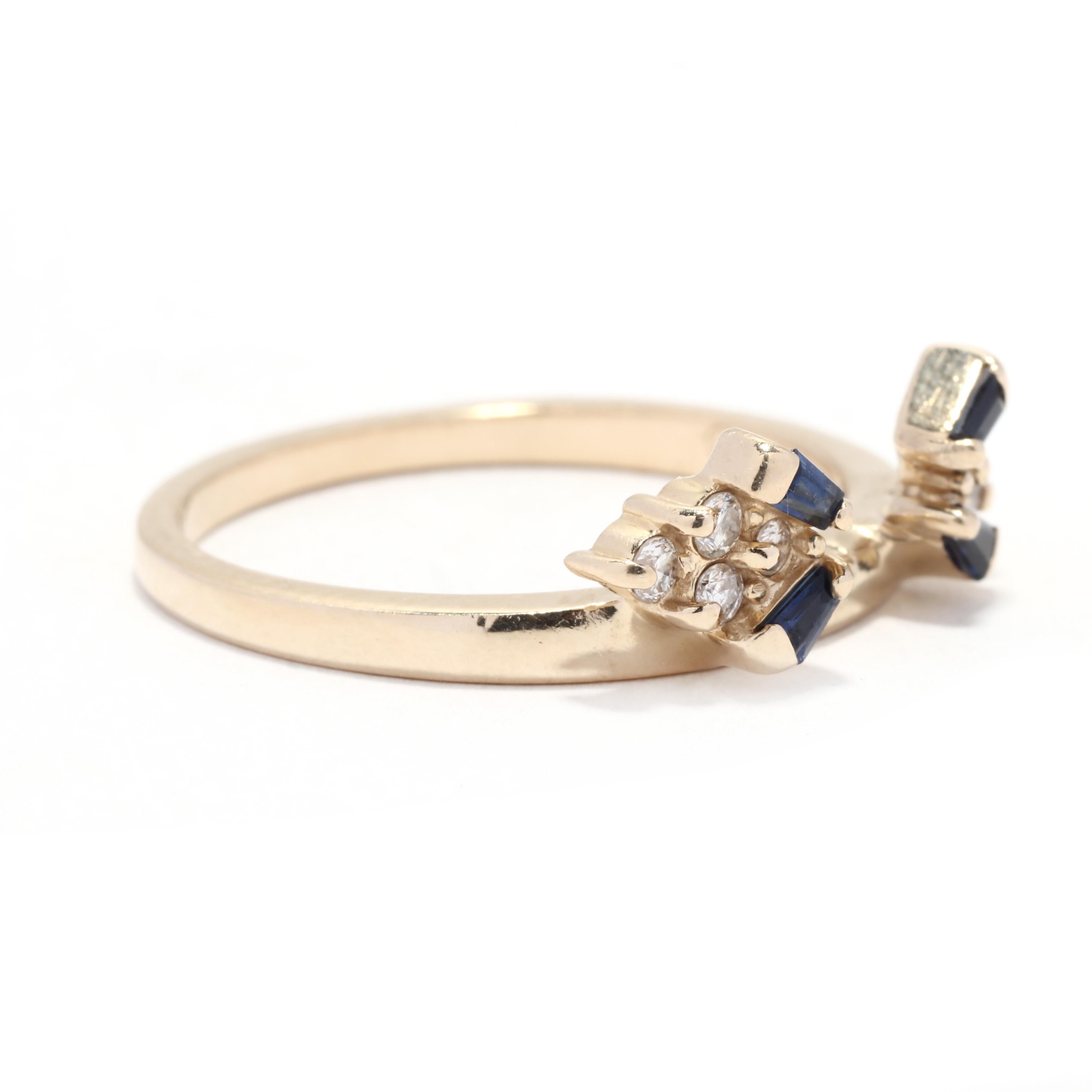 A vintage 14 karat yellow gold diamond and sapphire wedding wrap ring. This stackable ring jacket features a space in the center with two tapered baguette sapphires on either side weighing approximately .16 total carats and with a cluster of round