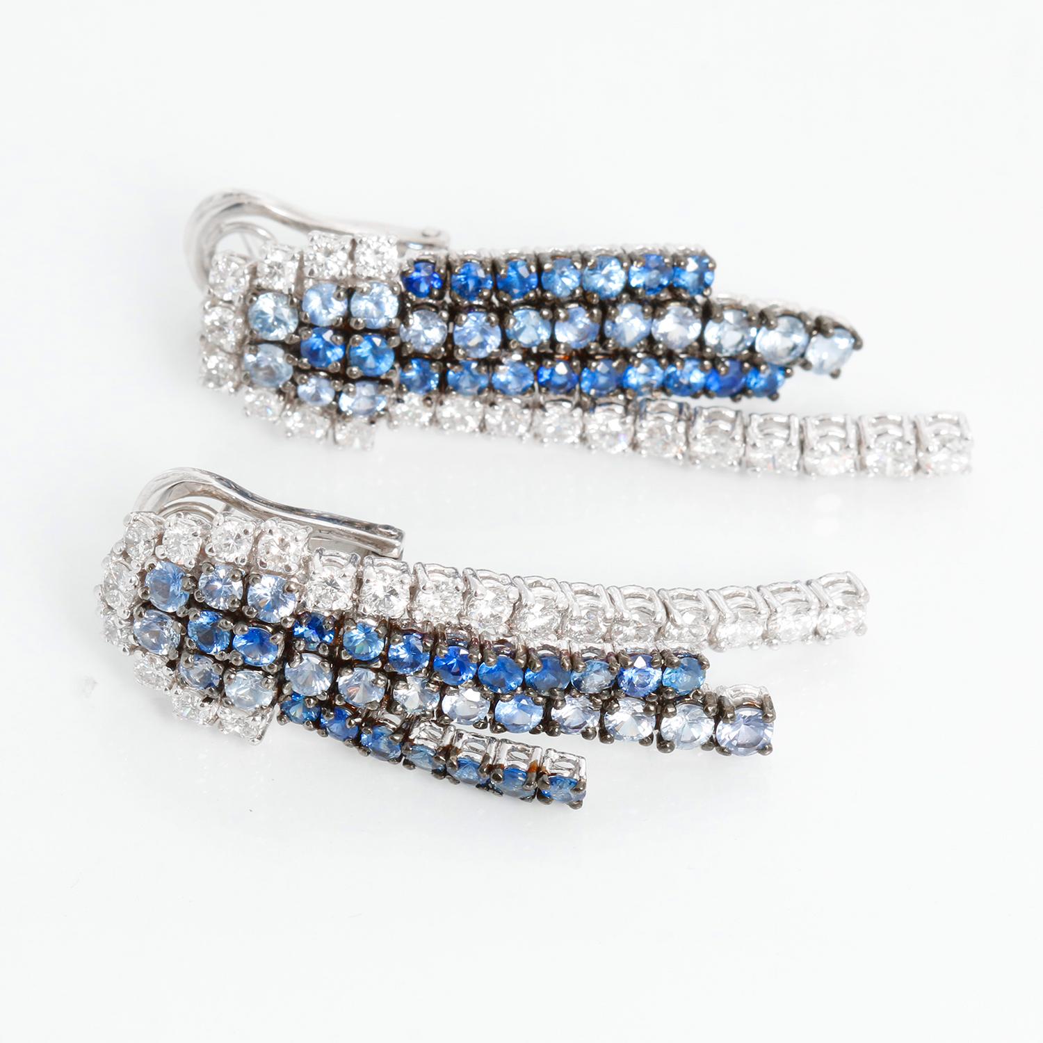 Diamond & Sapphire White Gold Earrings  - Full cut diamonds weighing approx. 2.10 cts. set in 18K White gold. With round cut sapphires weighing 5.30 cats.  1 3/4 inches long x 7/16. 
Diamond color G-H-I 
Clarity SI 