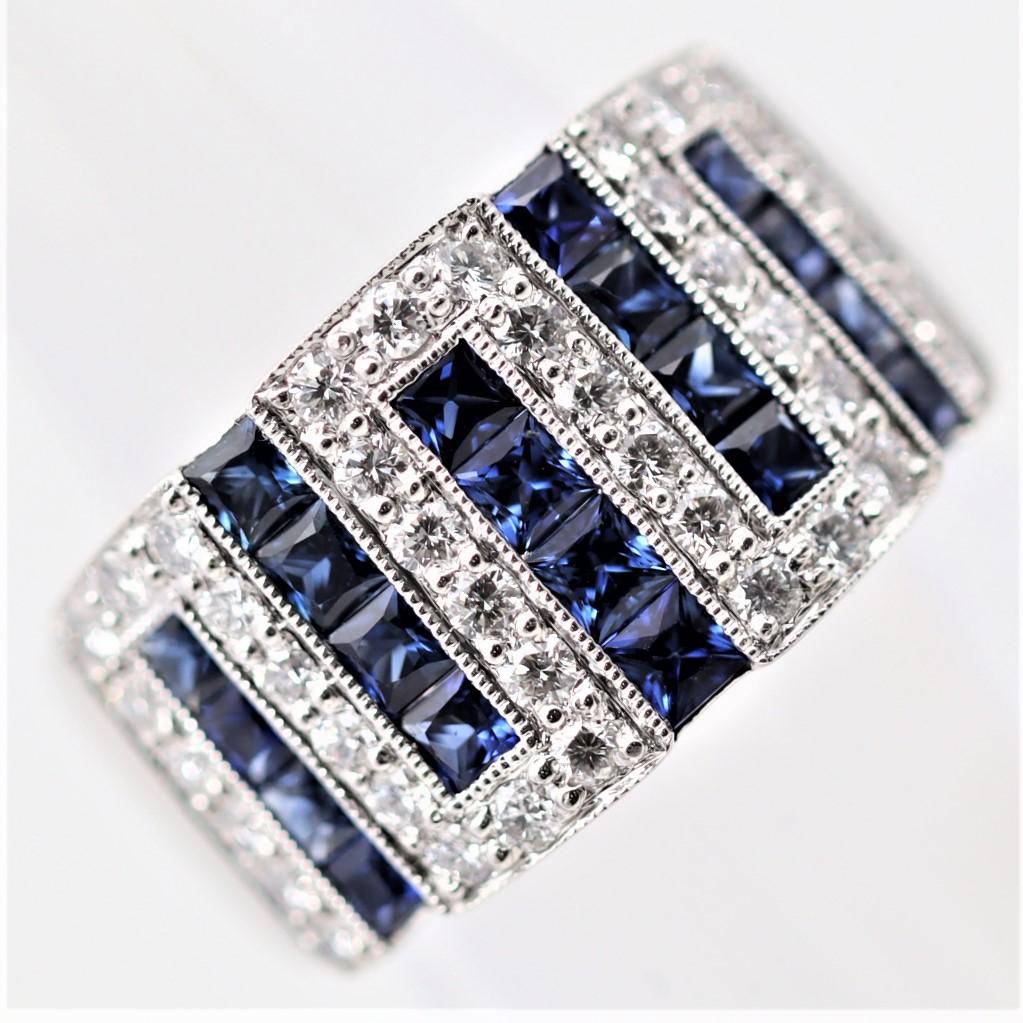 A fine and stylish wide band style ring, featuring 1.58 carats of square-shape blue sapphires and 0.60 carats of round brilliant-cut diamonds. They are set in a geometric style with milgrain finish around the diamond settings for added luxury.