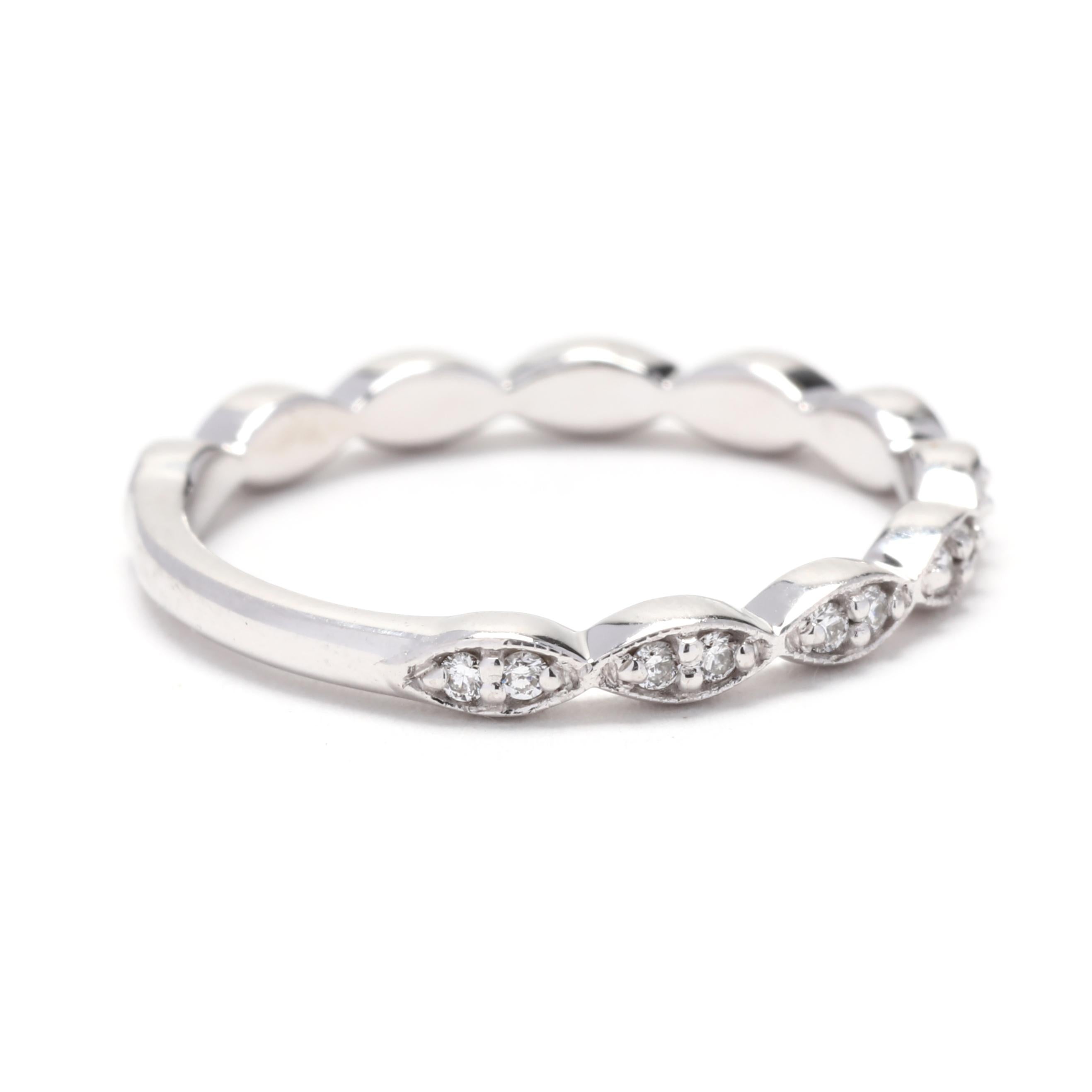 This diamond scalloped wedding band is a beautiful addition to any bridal set. Crafted in 14K white gold, it features a total carat weight of 0.20ctw of round cut diamonds. The scalloped design of the band creates a delicate and feminine look. The