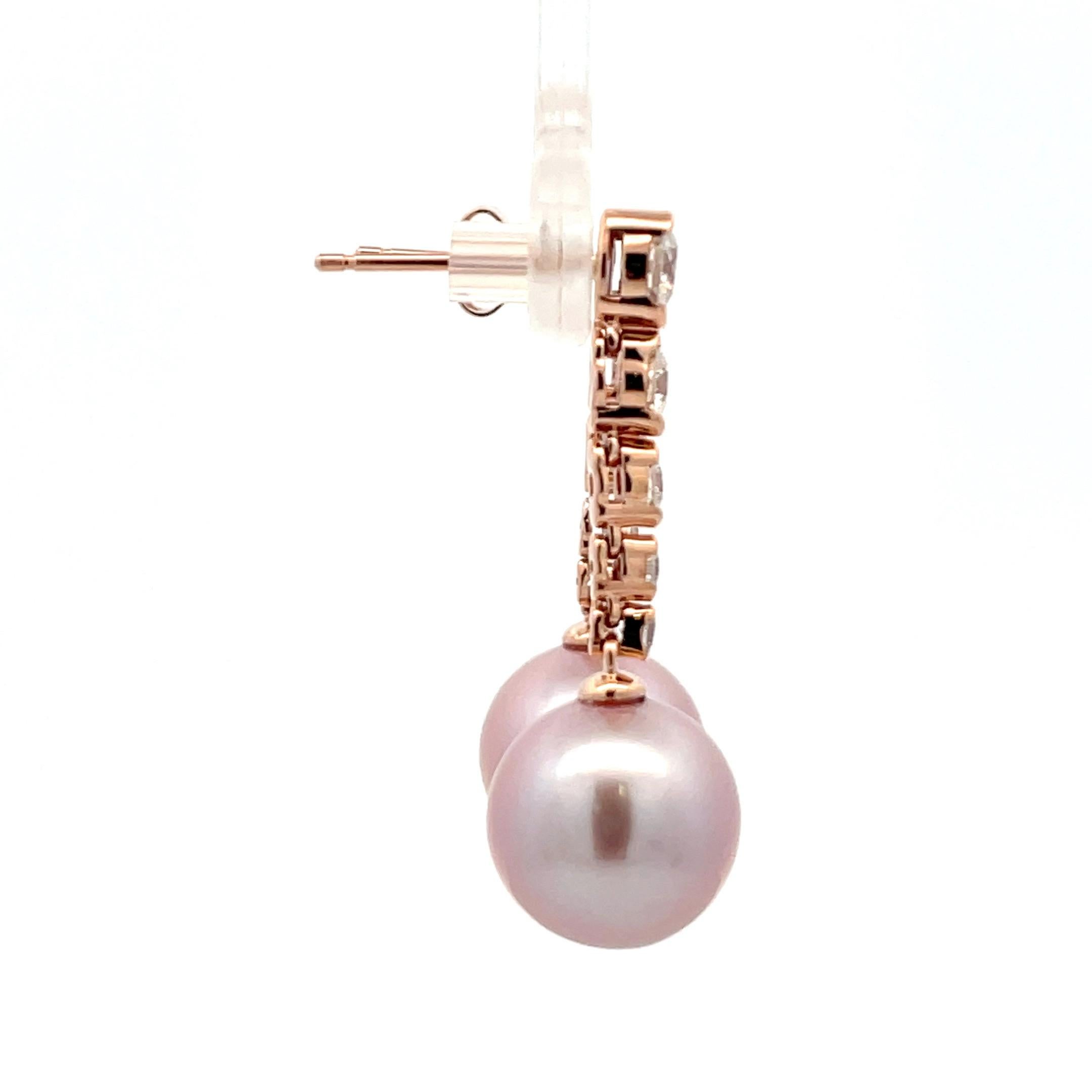14 karat rose gold drop earrings featuring 10 round brilliant weighing 0.76 carrots and two pink freshwater pearls measuring 10– 11 mm
Color G
Clarity SI