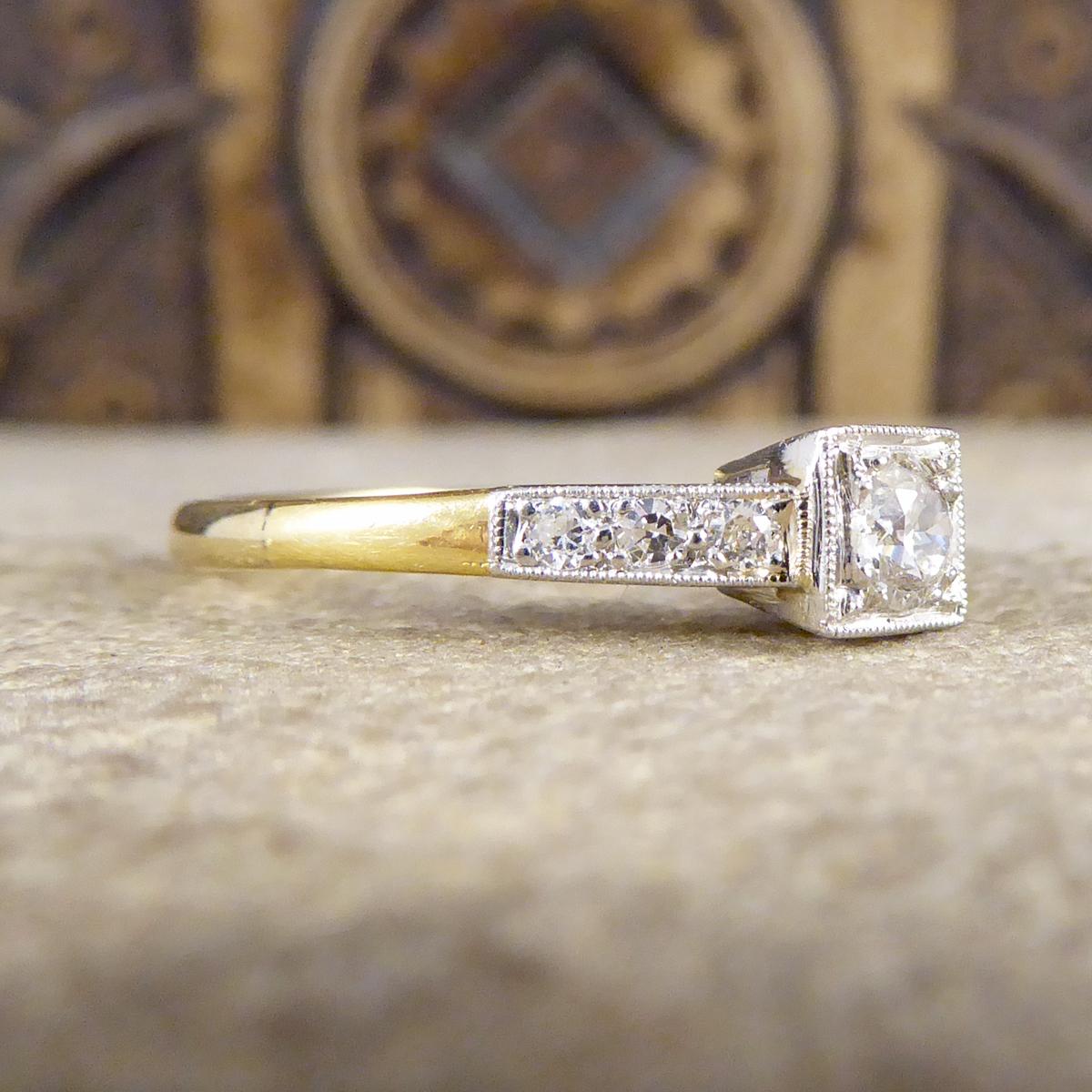 This ring was hand crafted in the Art Deco era and modelled form 18ct Yellow Gold with a Platinum setting, which is typical for pieces of this time. In the centre sits a 0.18ct Round Cut Diamond with Diamond set shoulders. A classic Art Deco ring