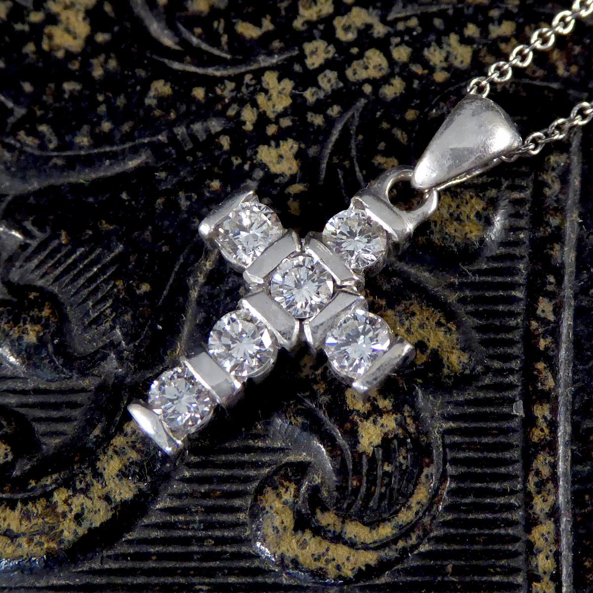 This Diamond set cross pendant necklace in 18ct White Gold is a symbol of faith and elegance, exquisitely crafted to be a cherished piece in any collection. The pendant features a classic cross design, beautifully adorned with meticulously selected