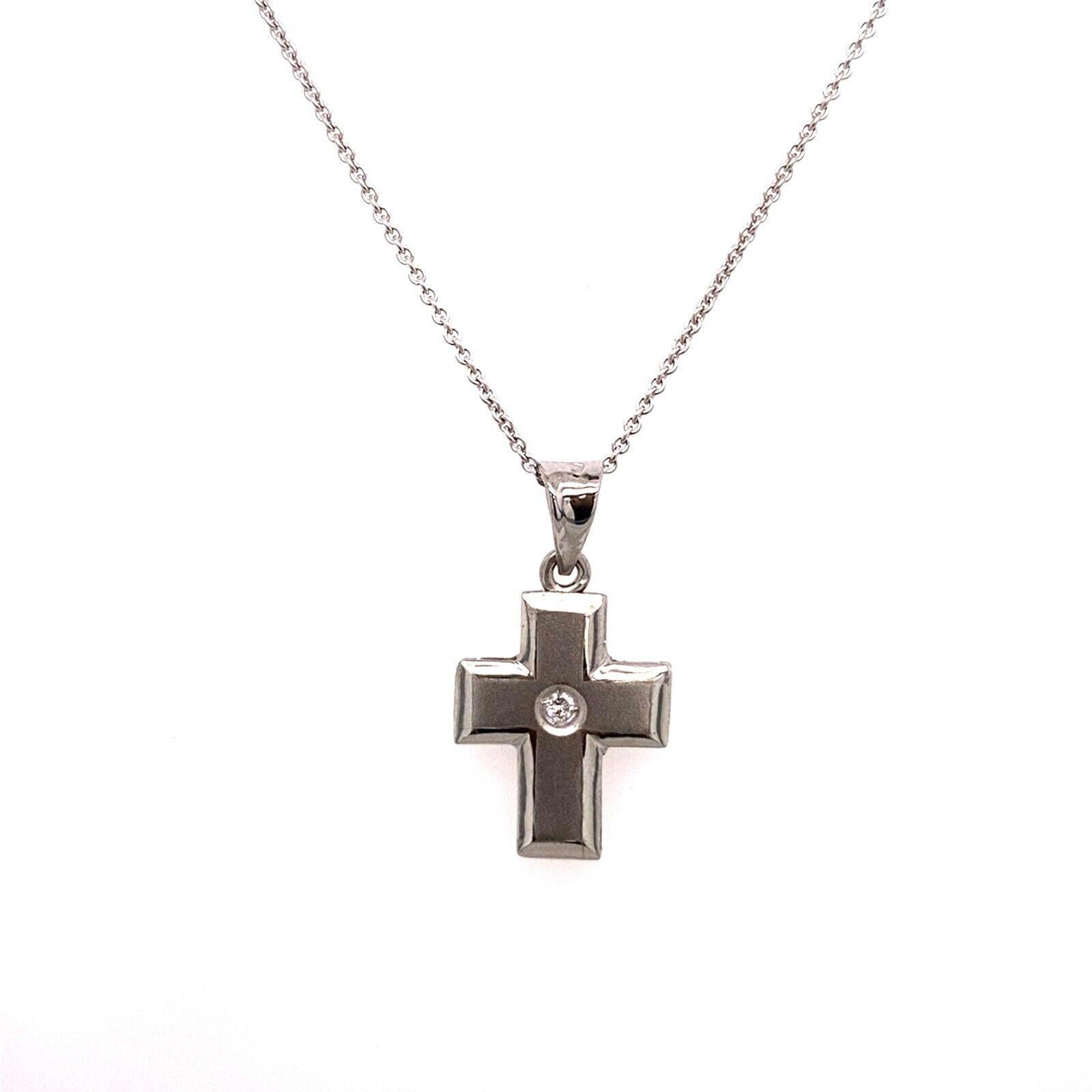 This delicate 18ct White Gold Diamond cross with matt finish, features a 0.05ct G-H/SI round brilliant cut Diamond, suspended on 18ct White Gold chain, can be worn with a 16-inch or 18-inch.This pendant is a perfect gift for your loved