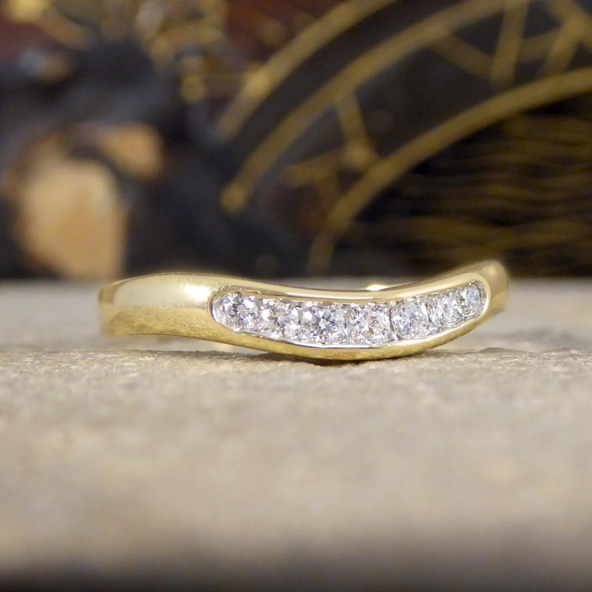 Such a beautiful Diamond set curved wishbone ring in Yellow Gold, designed to sit alone or perfectly, elegantly cradling your engagement ring. Crafted in lustrous 9ct Yellow Gold, this exquisite ring features a unique wishbone shape that curves
