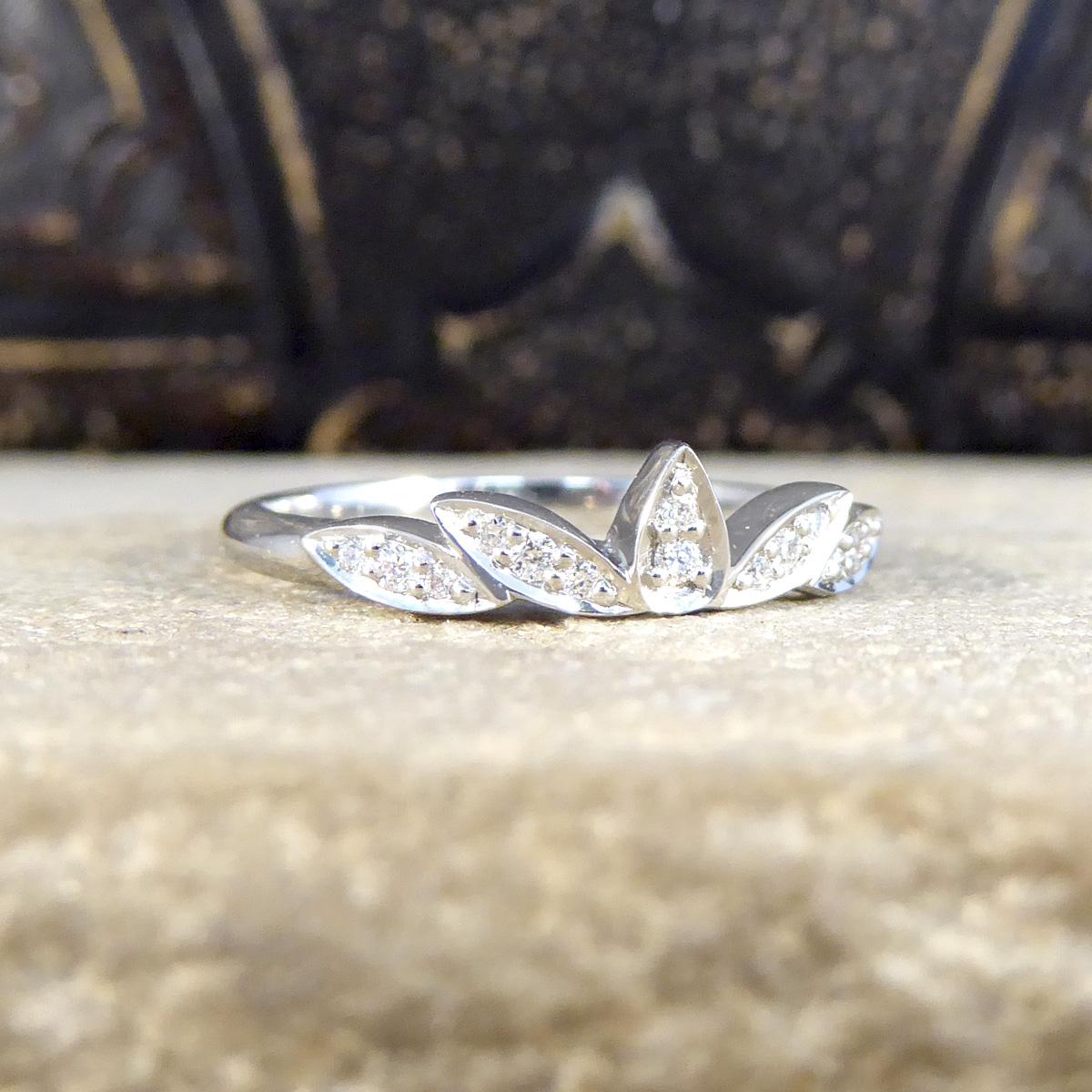 This ring works brilliantly on its own or as a stand out wedding or stackable ring. It is set with 14 Diamonds in a marquise shaped crown-like design allowing it to shine on its own or be the crown on top of an engagement ring with the design