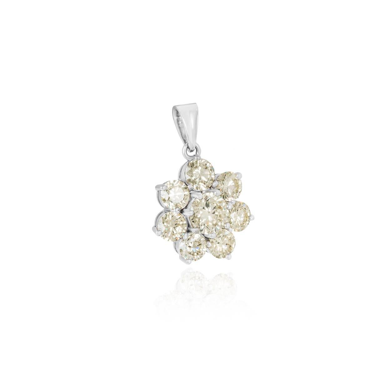 A large and beautiful 18k white gold diamond pendant. The flower style pendant is set with 7 round brilliant cut diamonds, the centre diamond weighs 1.96ct and the remaining diamonds have a total weight of 5.07ct. The diamonds are predominantly M