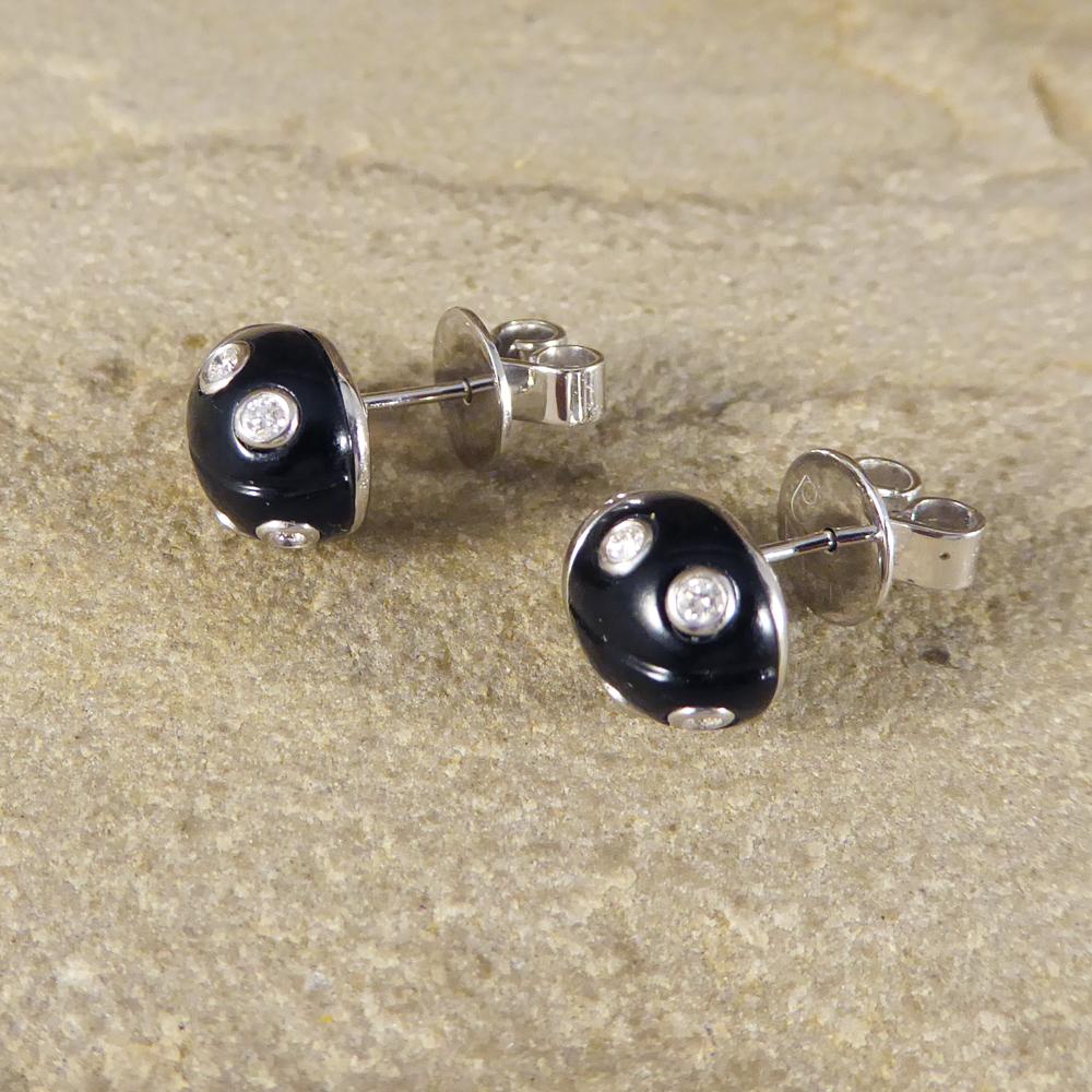 Cute little black enamel Lady Bird earrings that have been crafted from 18ct White Gold. These gorgeous studs have Diamonds as the Lady Bird spots and have a secure butterfly back. The perfect earring to be worn daily. 

Diamond details:
Cut: Round