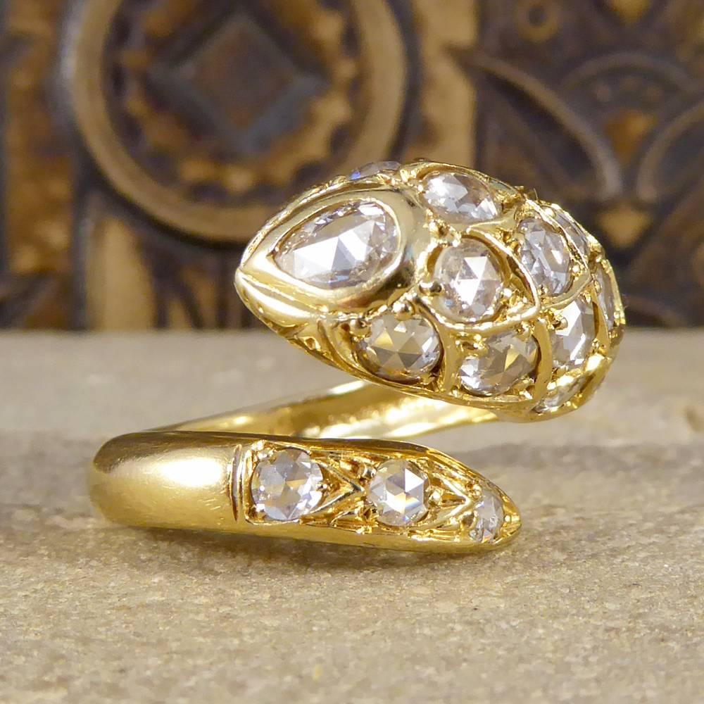 This grand and stand out serpent ring is formed using 18ct Yellow Gold and Rose Cut Diamonds. It has 17 Diamonds on the main body of the ring creating the illusion of the head, and 3 Diamonds set into place on the tail. Although serpent jewellery is