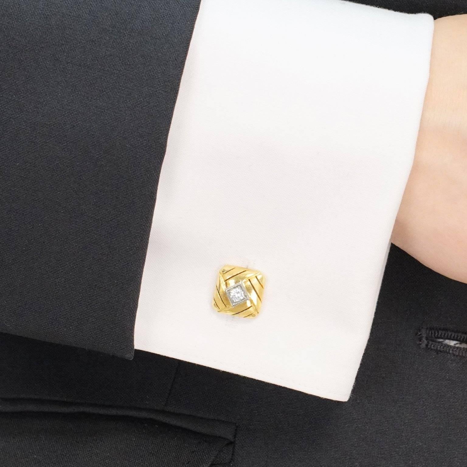 Circa 1960s, 14k.  This pair of cufflinks will add an understated dash of elegance to any suit or sport jacket. Styled in a textured woven motif, the design is centered by a diamond in a white gold frame. Meticulously made, they are in excellent