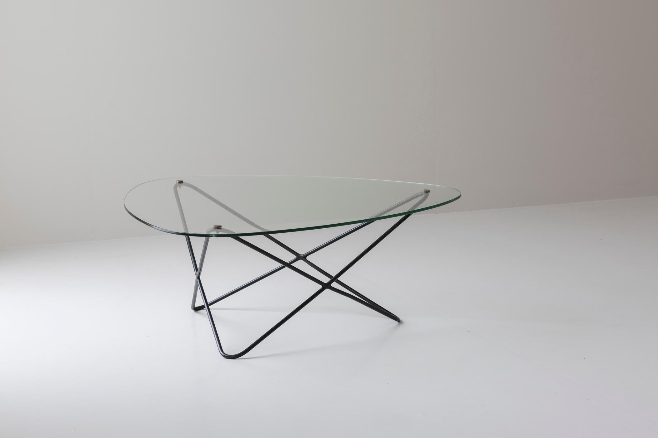Diamond shaped coffee table by Florent Lasbleiz manufactured by Airborne France in 1954. Featuring a sleek clear glass top, the table rests gracefully on a black lacquered steel base that complements its minimalist aesthetic. The sharp geometric