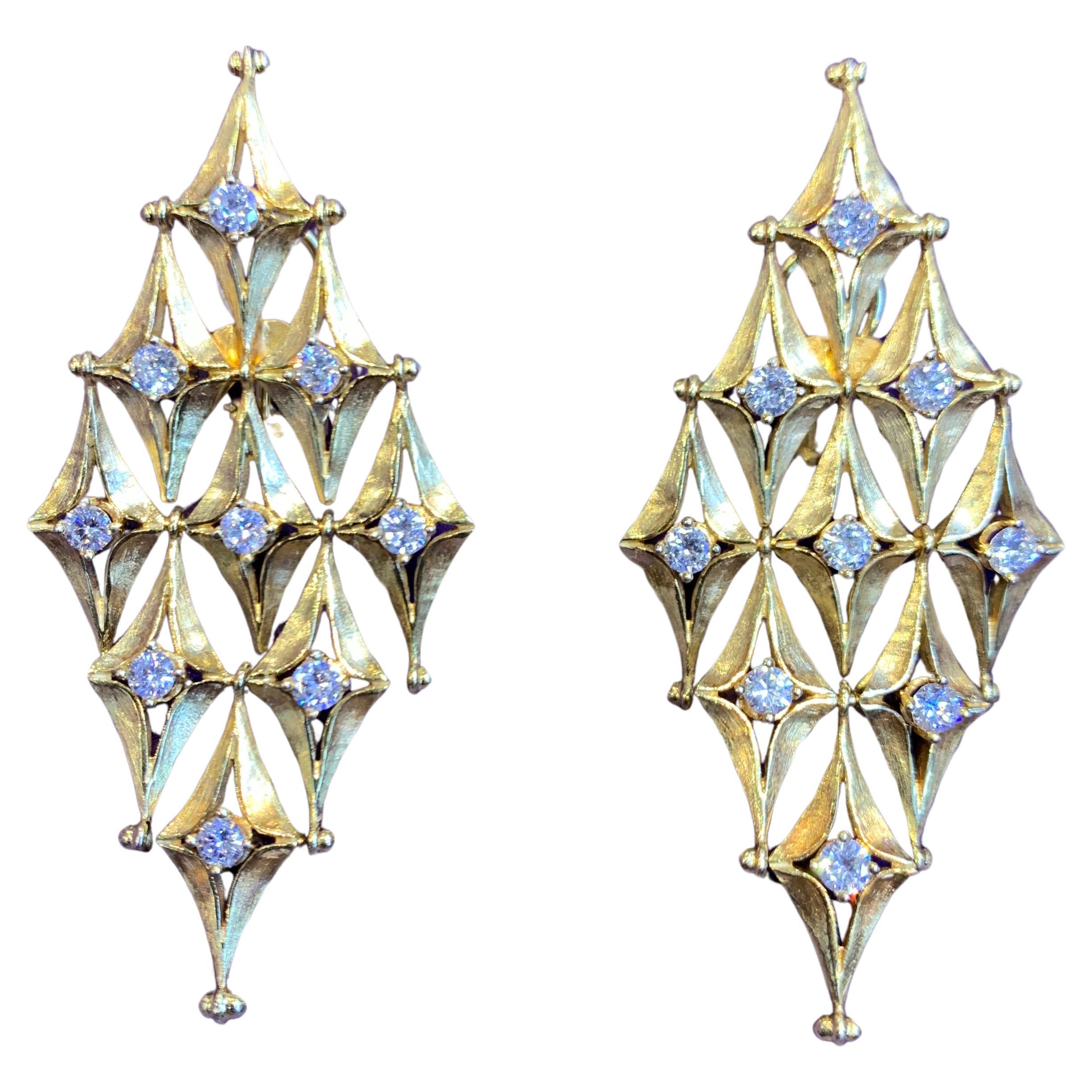 Diamond Shaped Diamond Earrings

A pair of 18 karat yellow gold earrings set with 18 round cut diamonds 

Total Approximate Diamond Weight: 2.08 carats

Measurements: 2.25