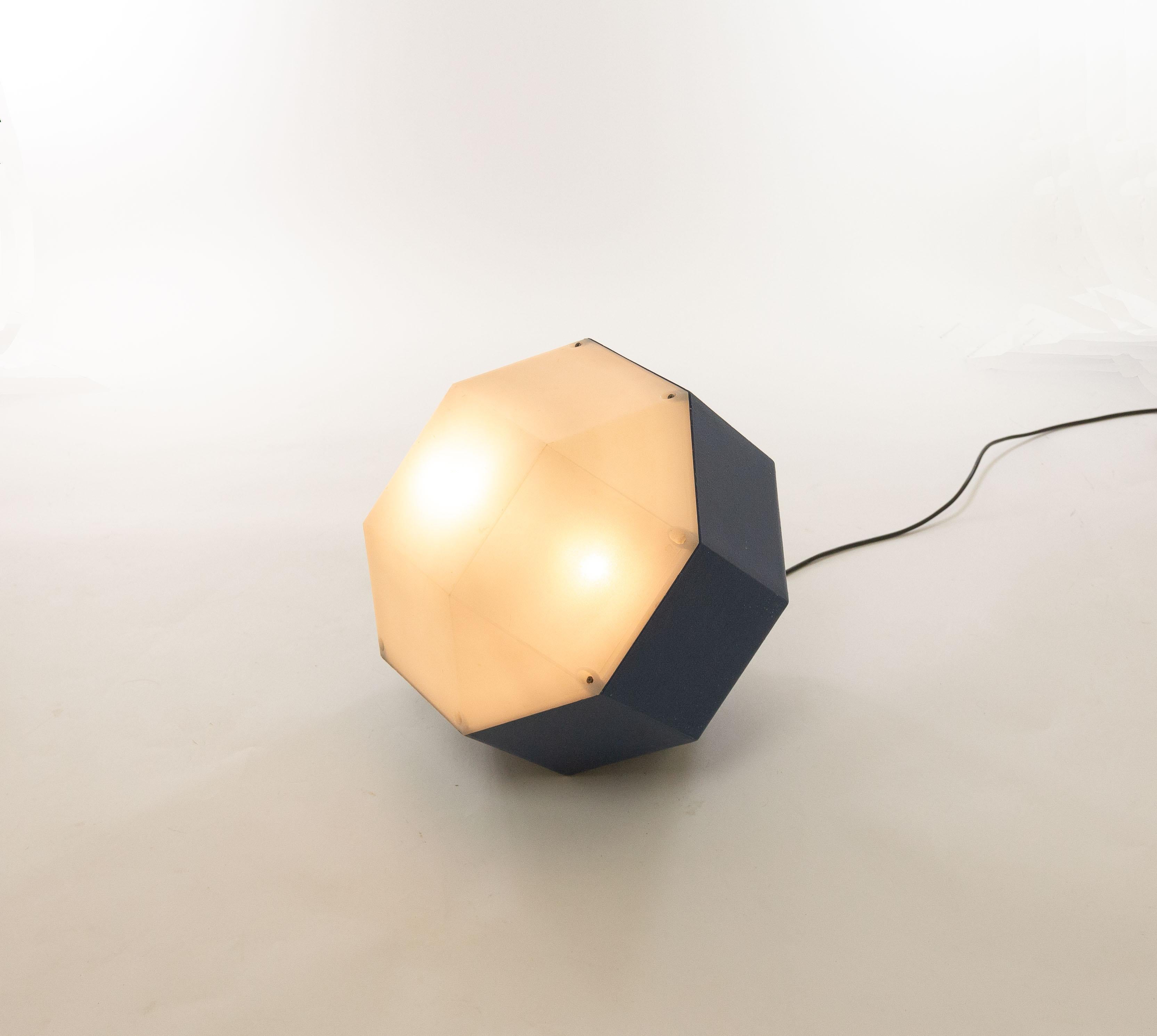 Playful geometric and diamond shaped lighting object, most likely manufactured in the Netherlands in the 1970s.

The signs of use on the back of the lamp indicate that the lamp has been used as a wall lamp. It can also easily be used as a floor
