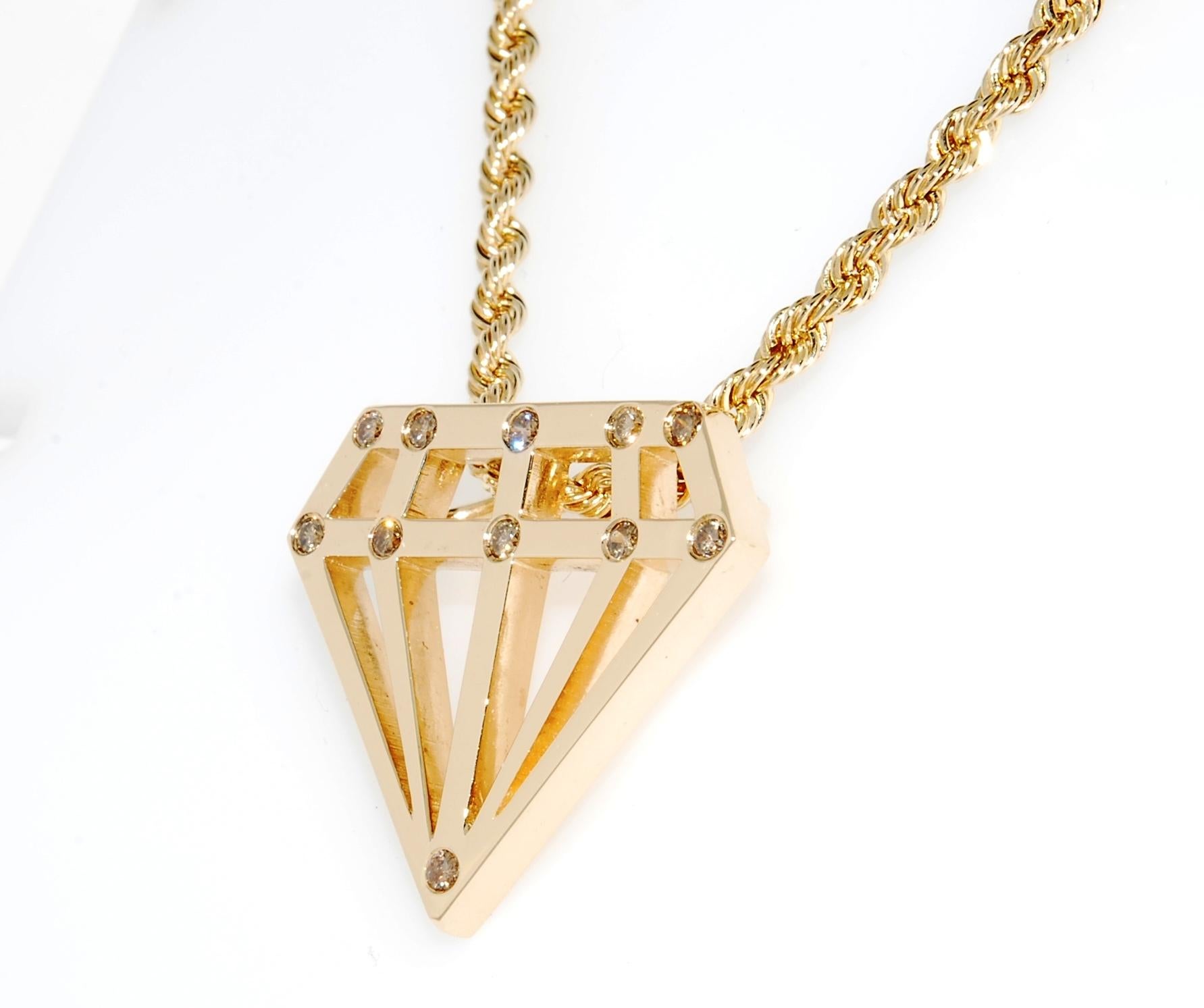 Whimsical play on a diamond pendant. This diamond shaped pendant is in 14 karat yellow gold and weighs 10.9 grams. It has 11 round full cut champagne diamonds set in it and the total carat weight is  0.40 carats.  It comes with an 18