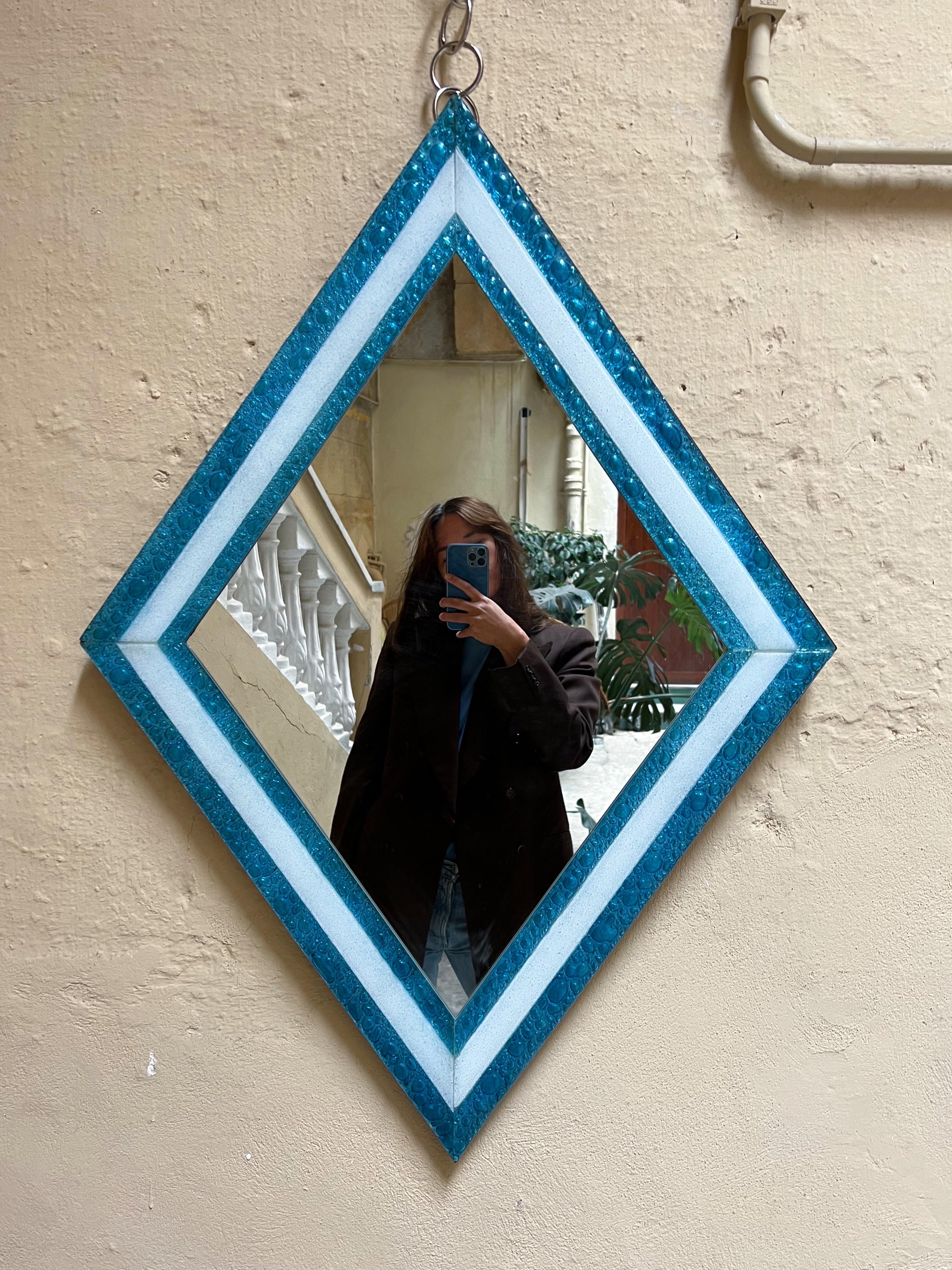 Diamond-shaped wall mirror from La Murrina, 1980s. The glass frame is highly decorative with its amazing structure in the glass. Aquamarine strong blue color with white contrast. Wooden backside. In very good vintage condition.
