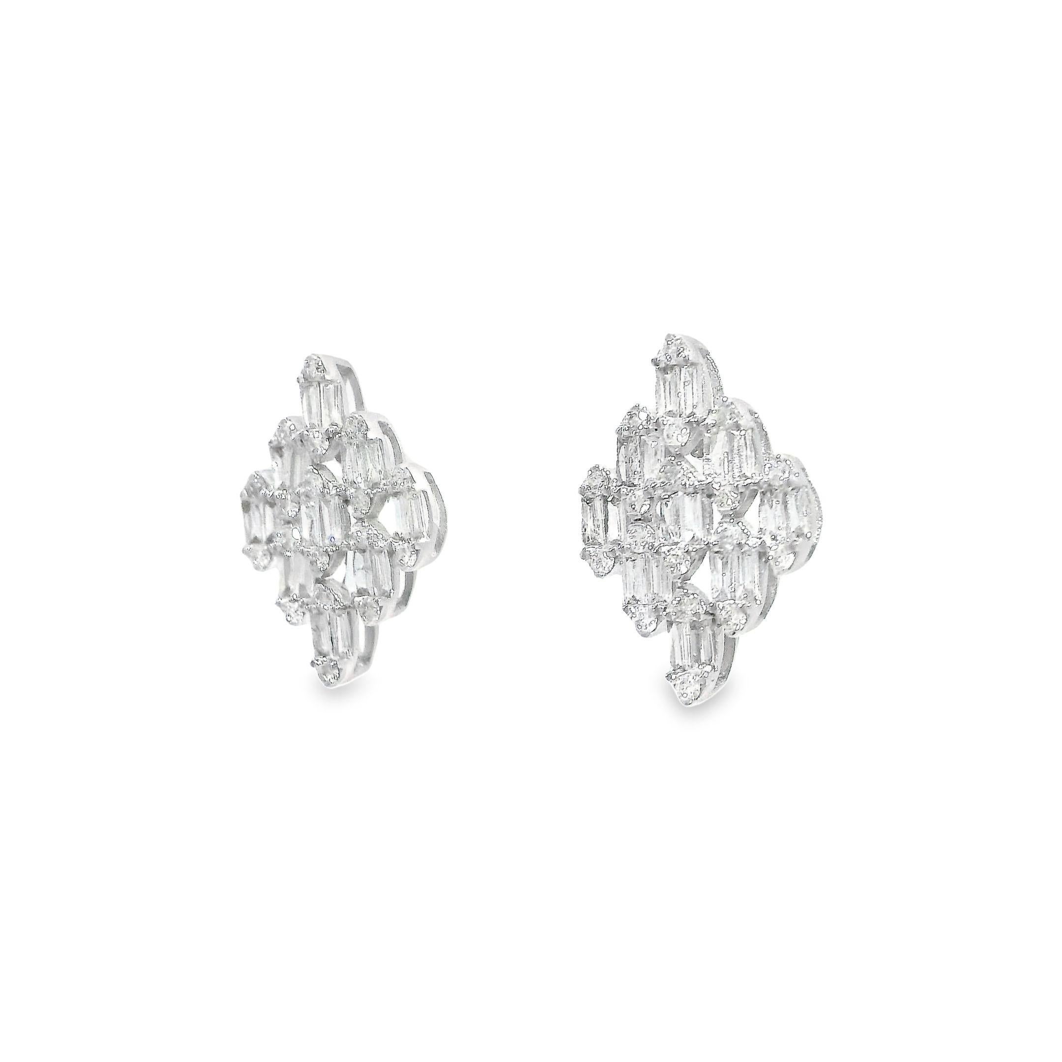 These exceptional diamond stud earrings from our collection epitomize the fusion of timeless elegance and modern allure. Meticulously crafted in lustrous 18-karat white gold weighing 1.394 grams, each earring showcases a captivating diamond cluster