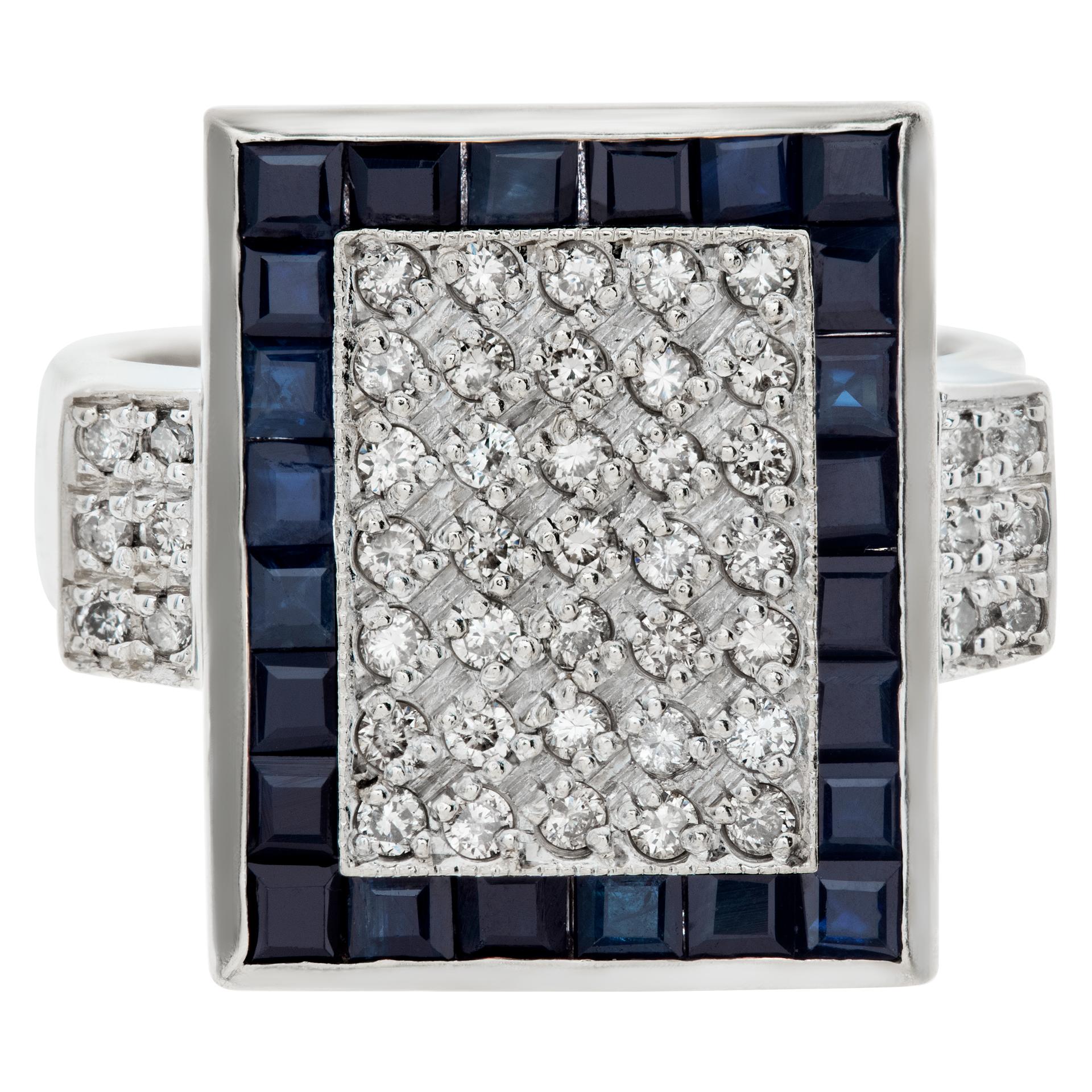 Diamond sheild ring in 18k white gold with 0.75 carats in pave diamonds with dark blue square cut sapphire frame. Size 7.25.This Diamond/Sapphires ring is currently size 7.25 and some items can be sized up or down, please ask! It weighs 6.6
