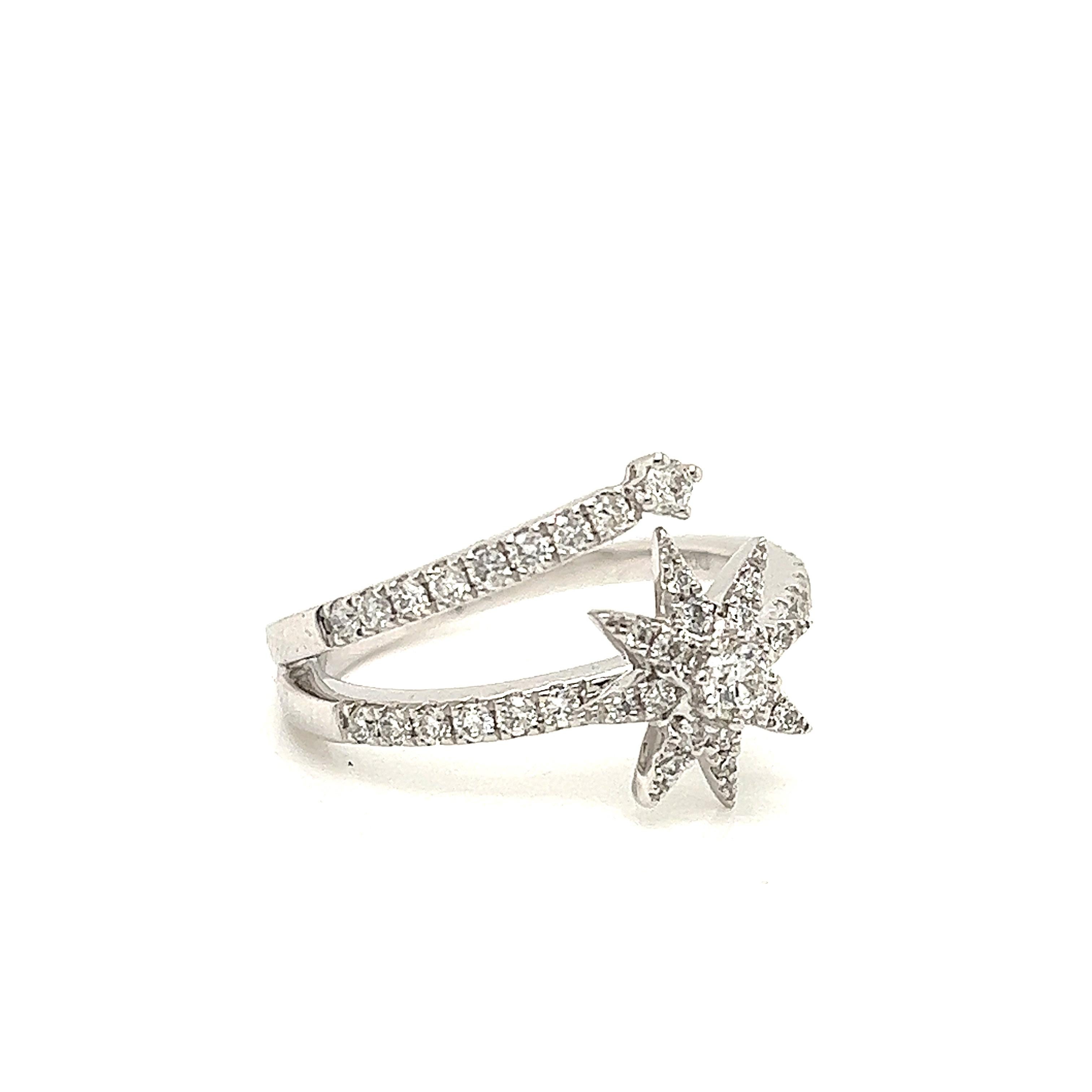 Amazing design crafted in 18k white gold. The ring is set with round brilliant cut natural diamonds that display a beautiful shooting star design. The ring splits to a double band design that truly makes this ring look fantastic on finger. The ring