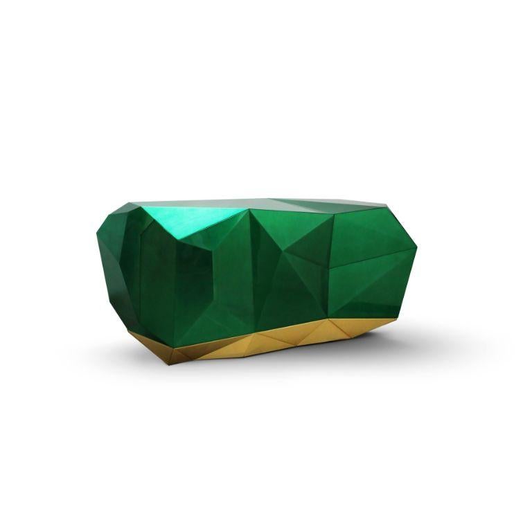 Modern Contemporary Diamond Emerald Sideboard by Boca do Lobo

Modern Contemporary Diamond Emerald Sideboard colored in green emerald, features three highly sculptured doors leading to a gold leaf interior with shelving and two drawers. The exterior