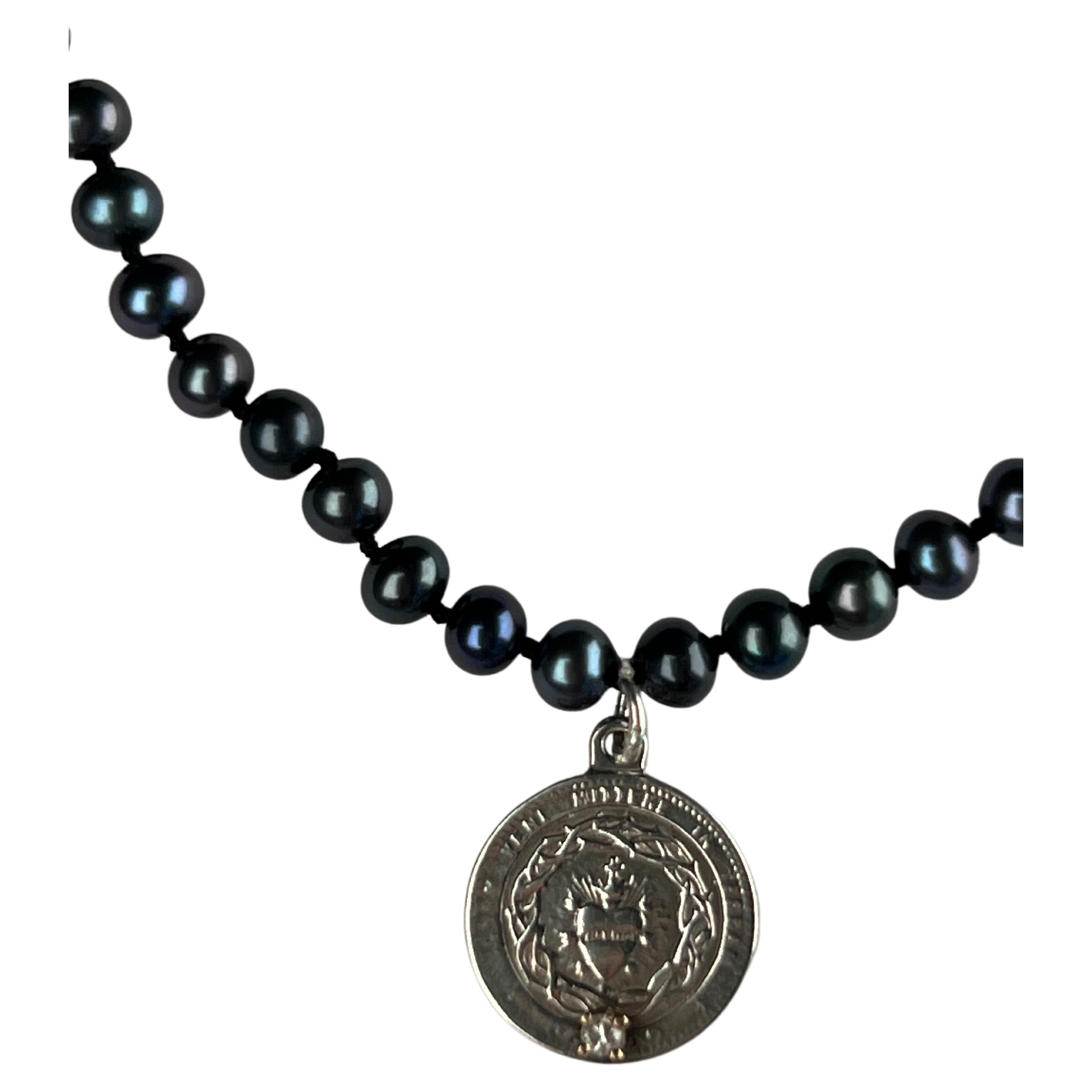 Diamond  set on a Silver Heart Medal on a Black Pearl Choker 16