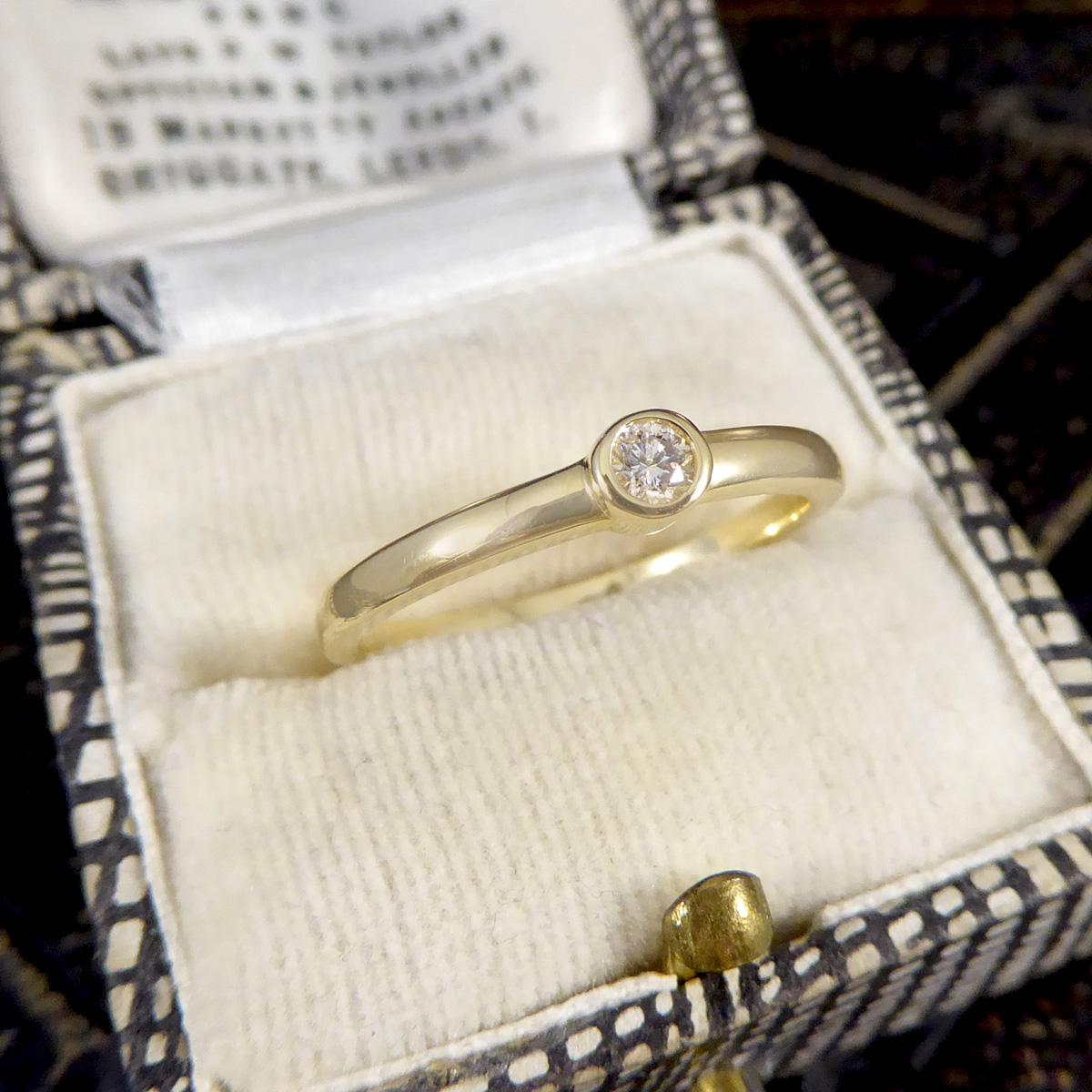 Women's Diamond Single Stone Ring in Yellow Gold Bezel Setting For Sale