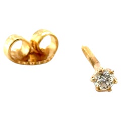 Orecchino singolo con diamante coniato da .08ct in oro giallo 14K con chiusura a vite