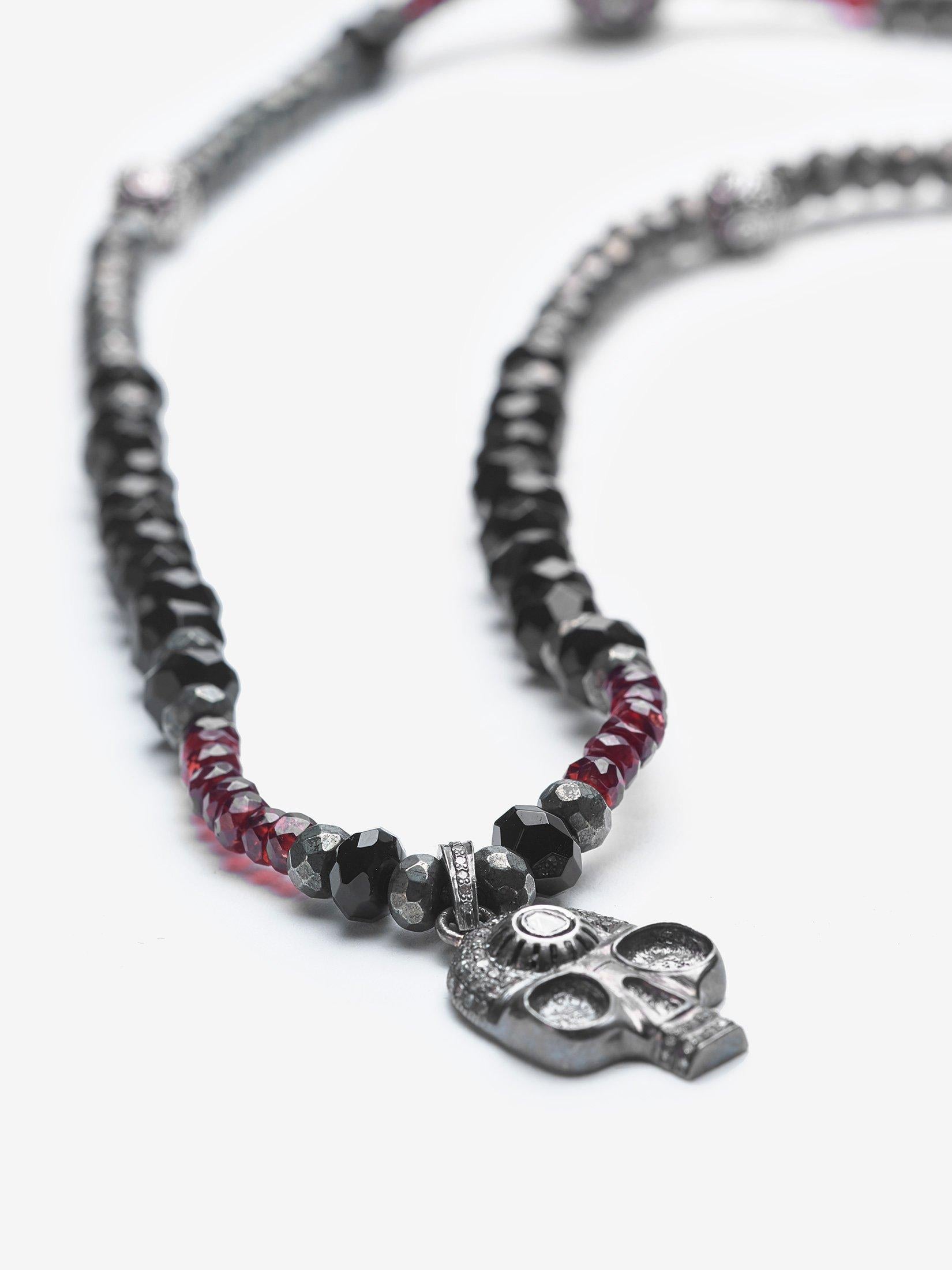 Story Behind the Jewelry
A favorite necklace among musicians.  Pure Fire is accented by a stunning skull that is adorned with rich garnet and pyrite.  Skulls have many interpretations.  The necklace was designed with the symbolic purpose as a