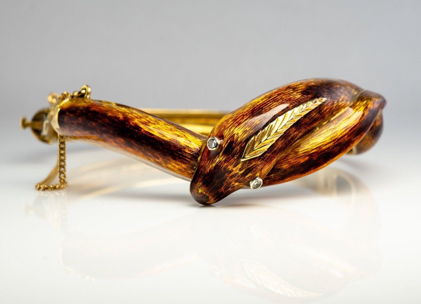 This rare and hard to find vintage bangle is made in the shape of a snake and crafted in solid 18K Yellow Gold. Two single cut diamonds for the eyes are estimated to be VS1 clarity and G color for the total .04 carat. The enamel is in excellent