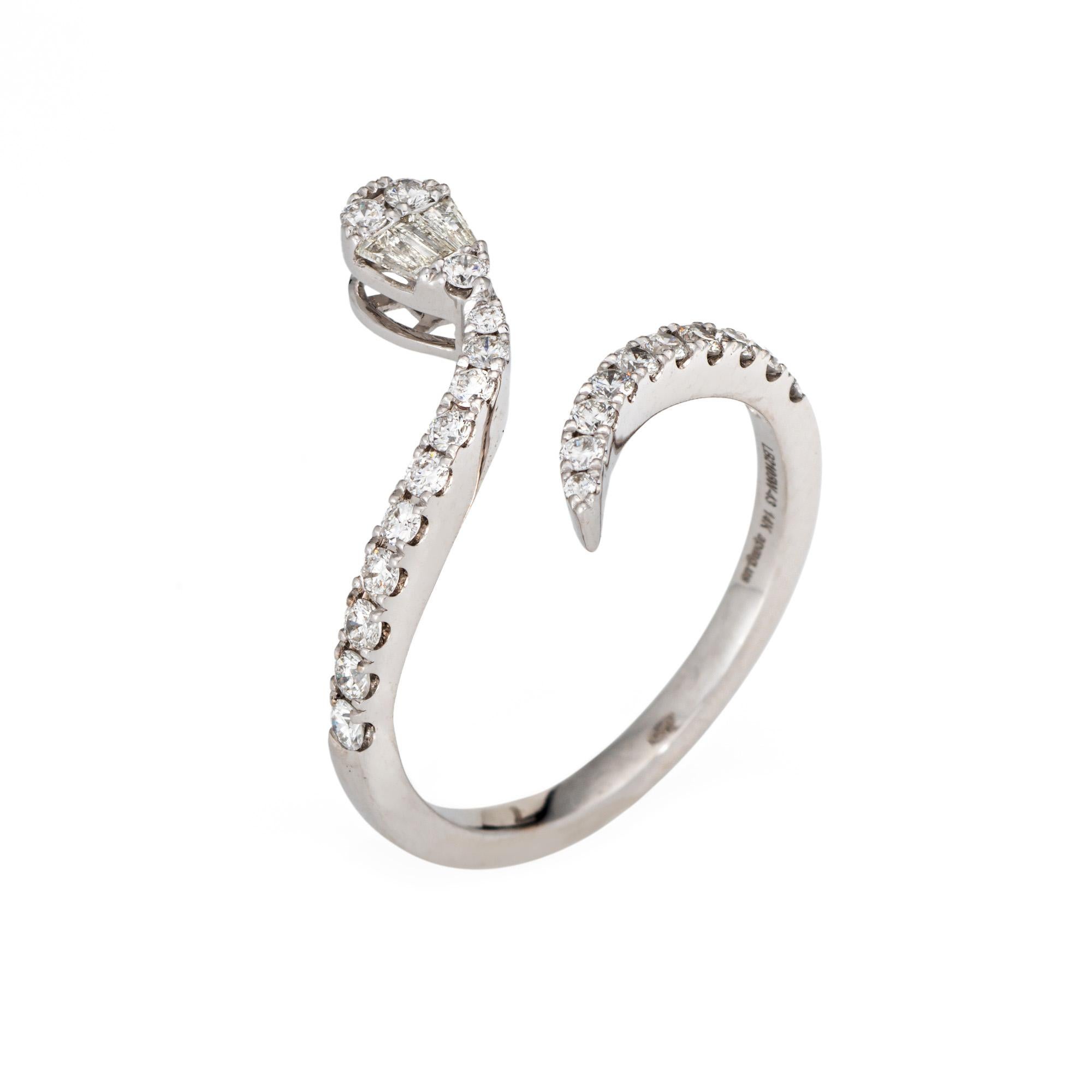 Finely detailed contemporary snake ring crafted in 14 karat white gold. 

Mixed cut baguette and round brilliant cut total an estimated 0.43 carats (estimated at H-I color and SI1-I clarity).      

For centuries the snake has represented eternal