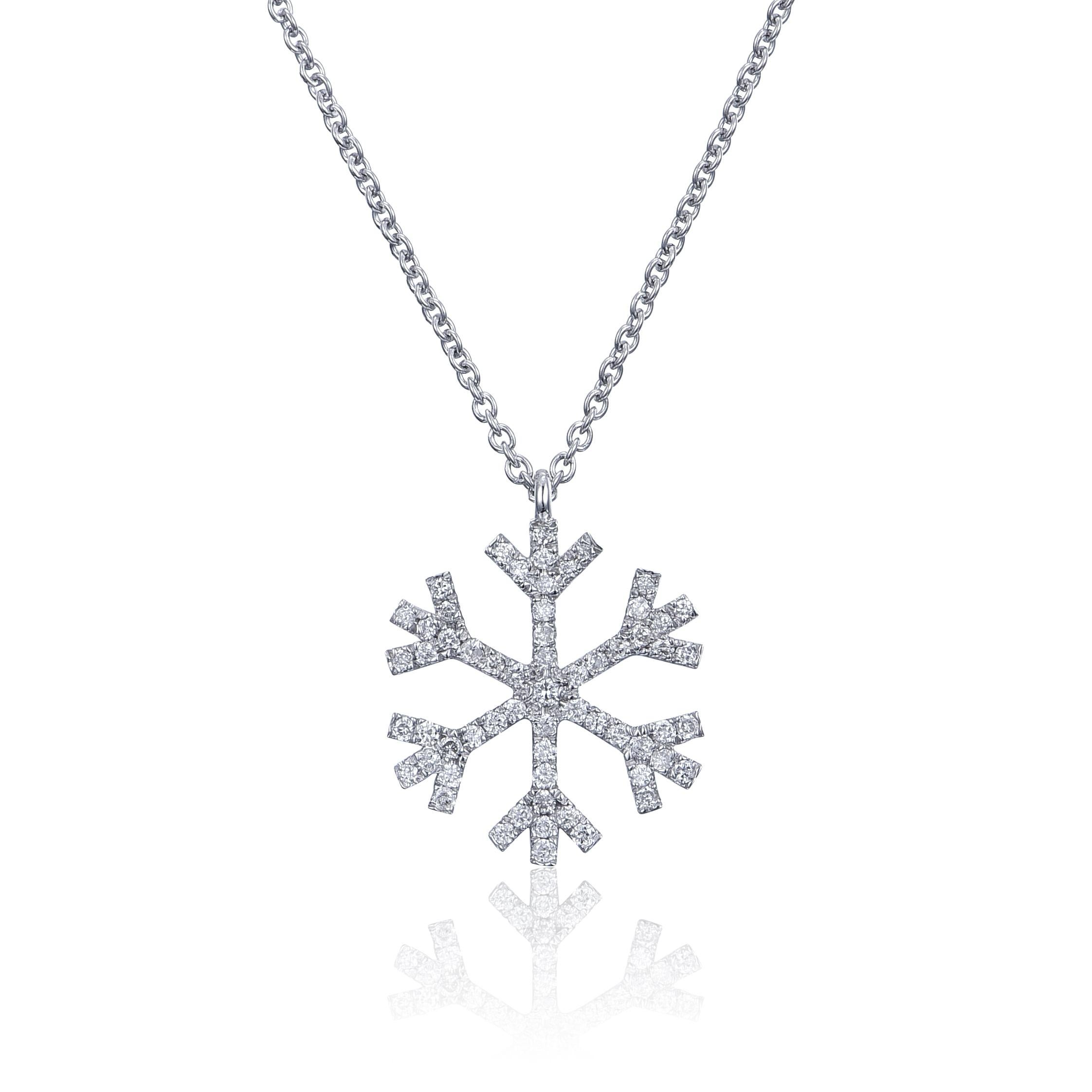 A diamond encrusted snowflake, 13.55mm, with  0.16ct round diamonds, G color, VS2 clarity is the perfect magical accessory. 