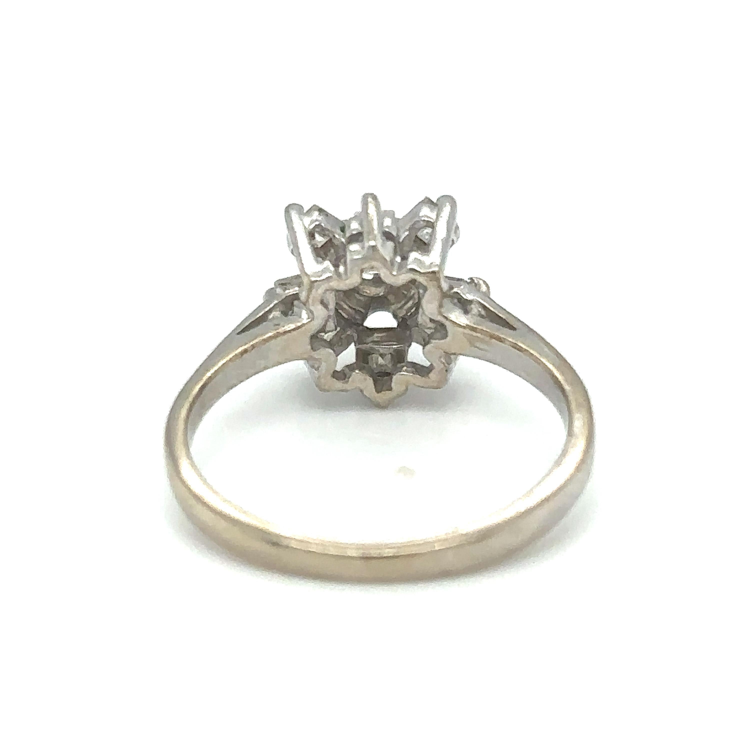Item Details: This snowflake style ring has carre cut diamonds and originates from Italy. It has a beautiful snowflake design visible from the top gallery. All diamonds are prong set. 

Circa: 2000s
Metal Type: 18 Karat White Gold
Weight: 2.6