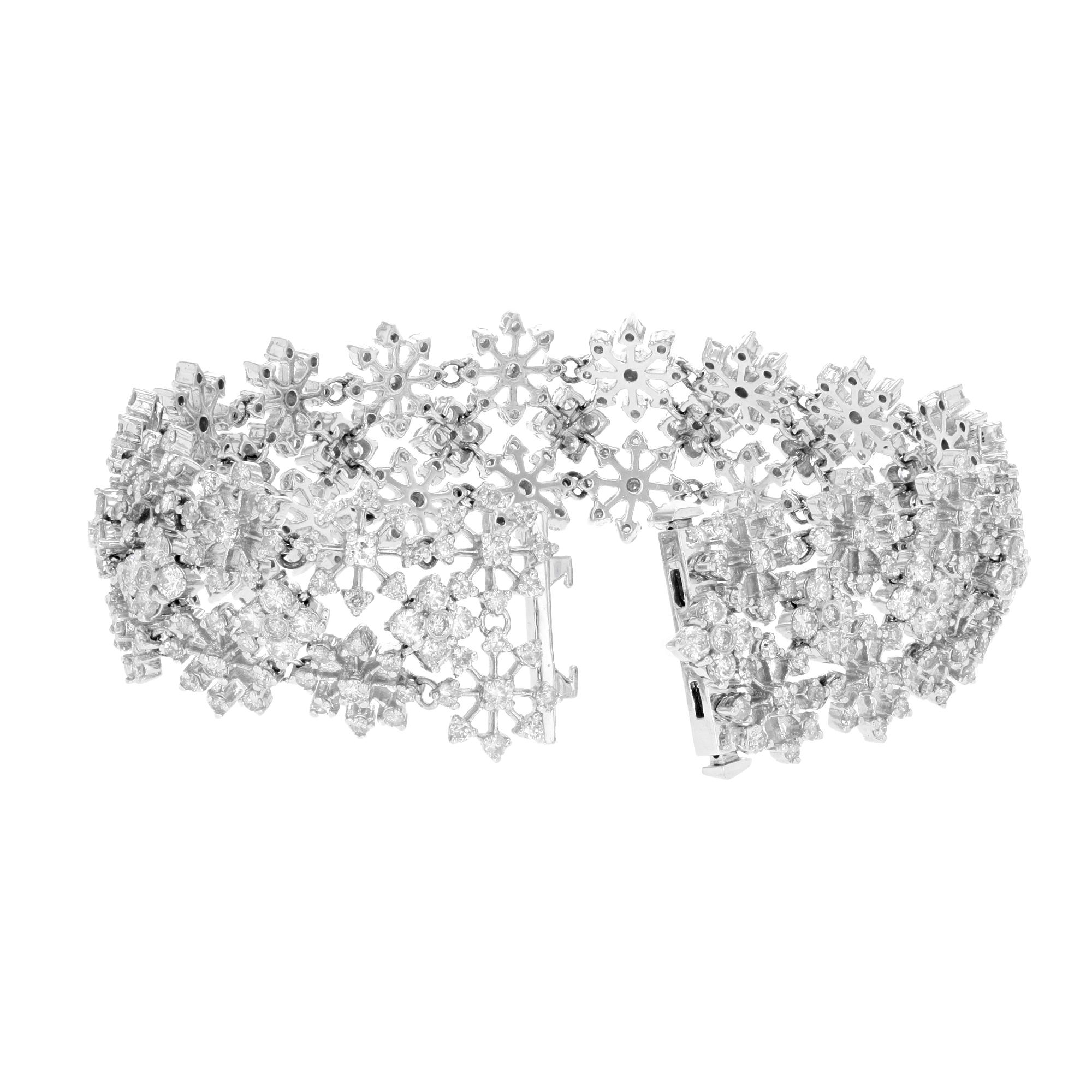 A glittering and glamorous late 20th century snowflake diamond bracelet, hand crafted in white gold and bursting with 4.60 carats of bright-white and sparkling round diamonds. Gentle and delicate diamond bracelet is composed of 17 distinct diamond