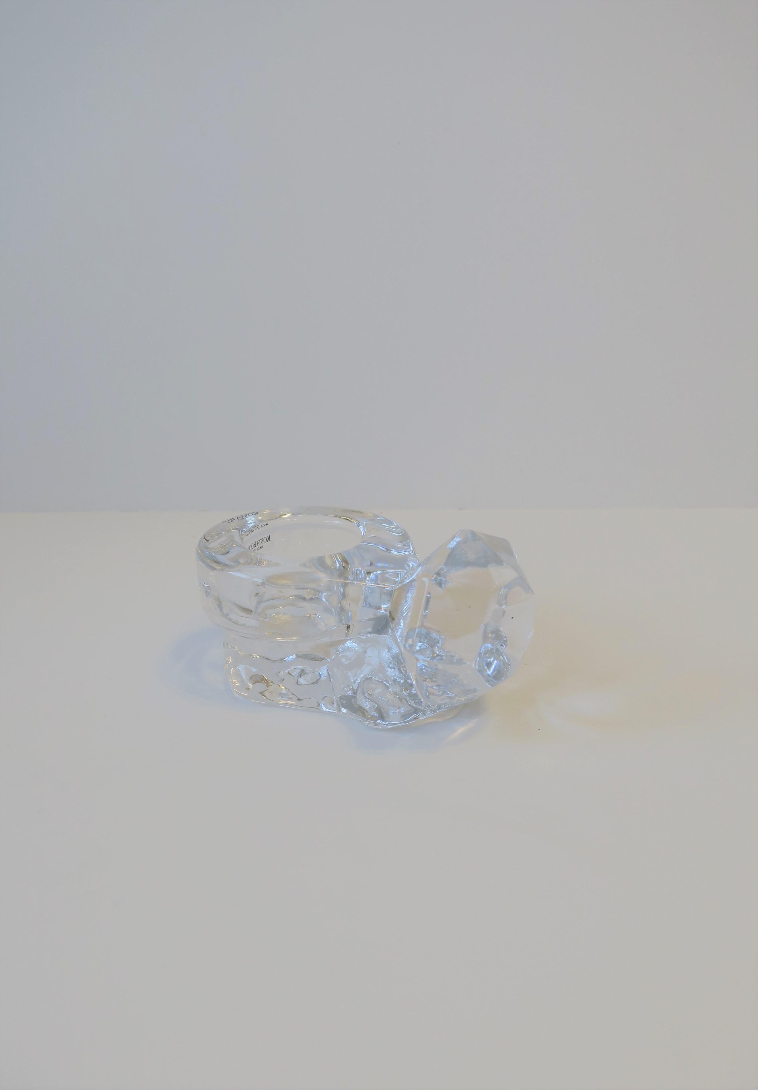 A beautiful and fun 'Diamond' solitaire ring crystal jewelry dish by Swedish maker Kosta Boda, Sweden. Jewelry dish, designed in the shape of a diamond solitaire ring, is well made and substantial. Piece could work well on a vanity, nightstand,