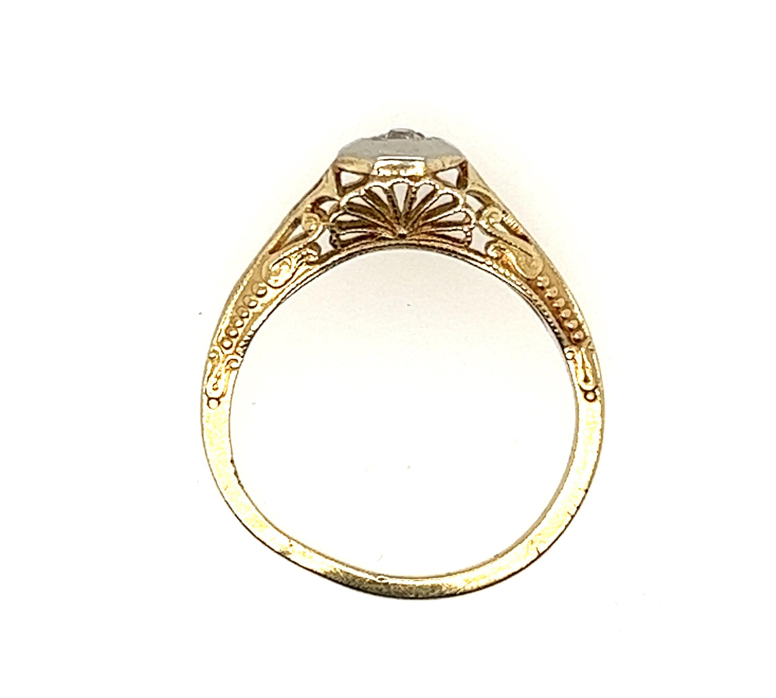 Genuine Original Antique from 1920's Diamond Solitaire Engagement Ring .05ct Old Mine Cut 14K 


Featuring a Gorgeous Genuine .05ct Natural Old Mine Cut Diamond Center

Very Rare Yellow Gold Art Deco Ring With a White Gold Top

Hand Engraved