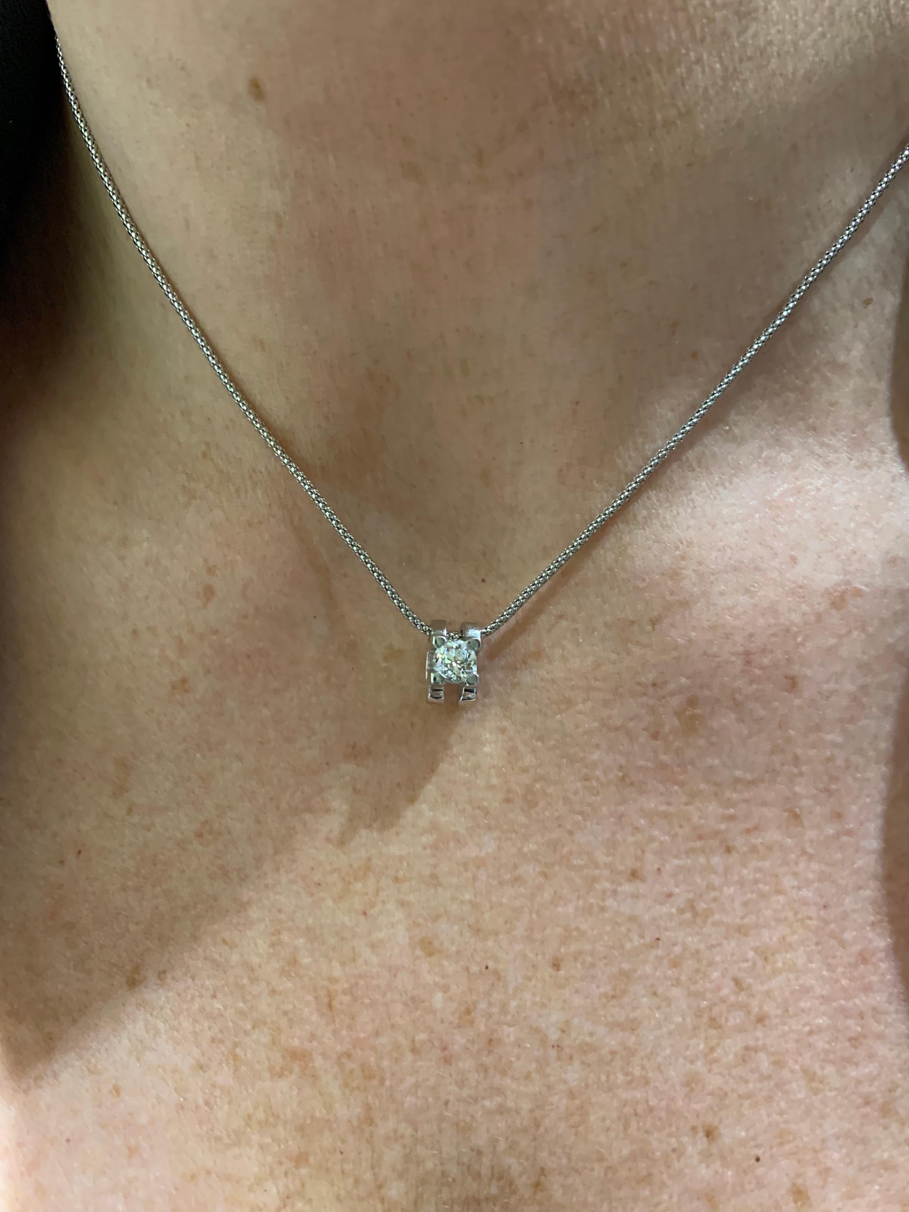 An 18k white gold diamond pendant. The diamond is an old European cut and weighs 0.56ct, the colour is H and the clarity is VS2. The diamond is set in a modern 4 claw setting. The pendant has an 18k white gold 16 inch chain and has a gross weight of